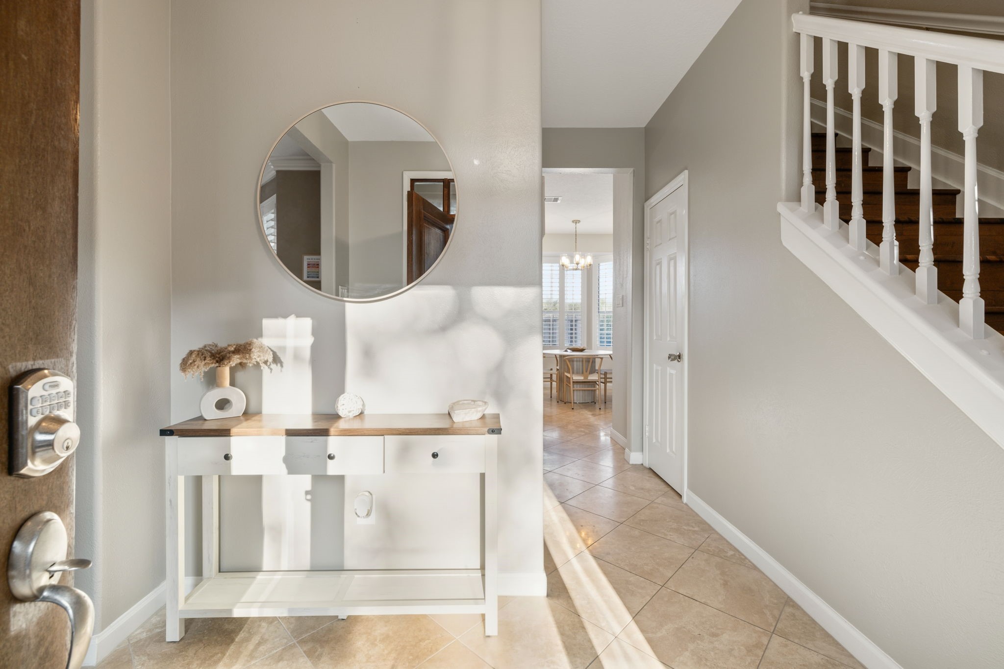A welcoming foyer offers warm neutral tones, tile flooring, and an inviting first glimpse of the home's interior. A welcoming foyer offers warm neutral tones, tile flooring, and an inviting first glimpse of the home's interior.