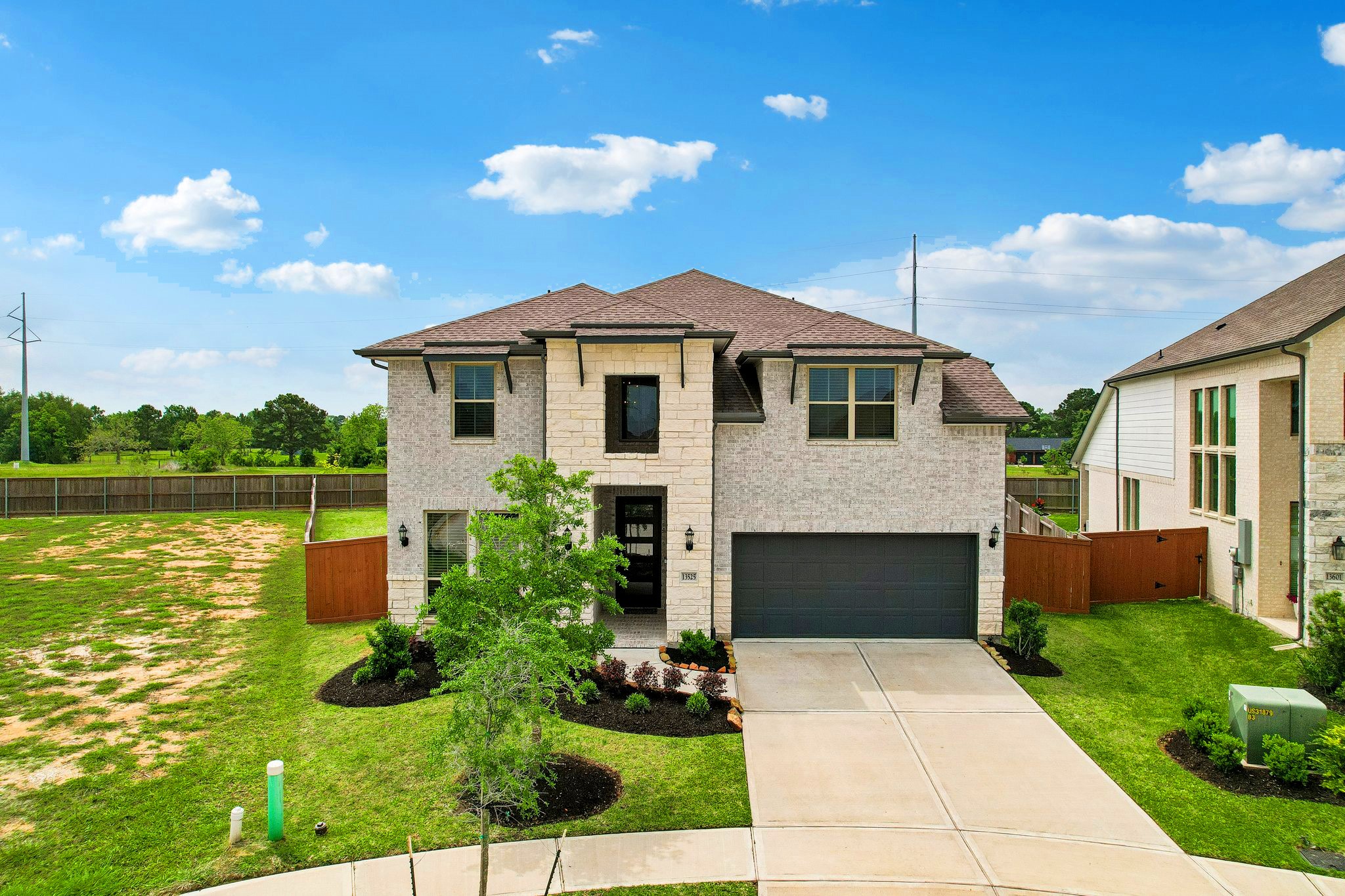 Well maintained landscaping, the brick and stone add to the curb appeal
