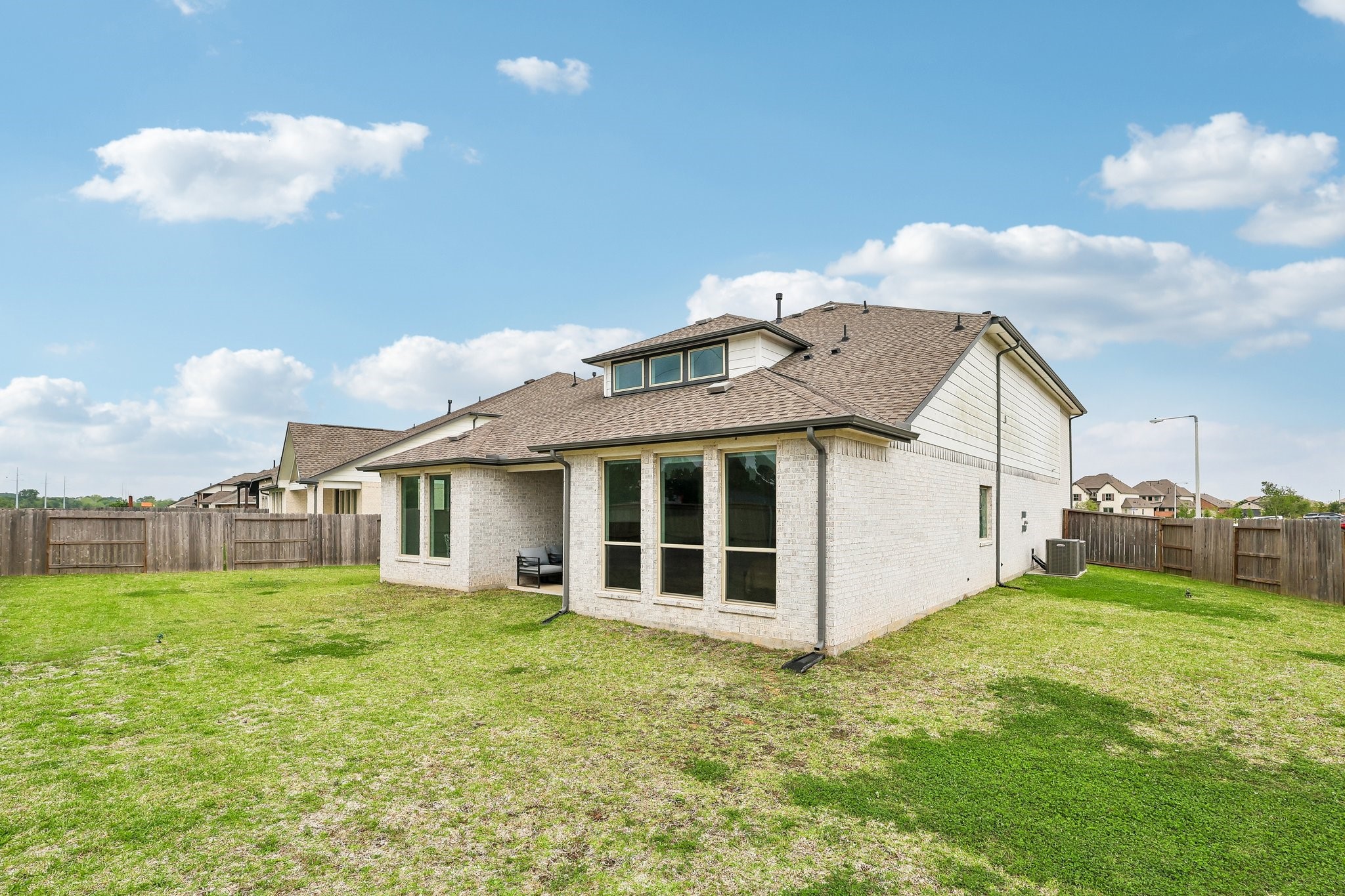 The home features four sided brick