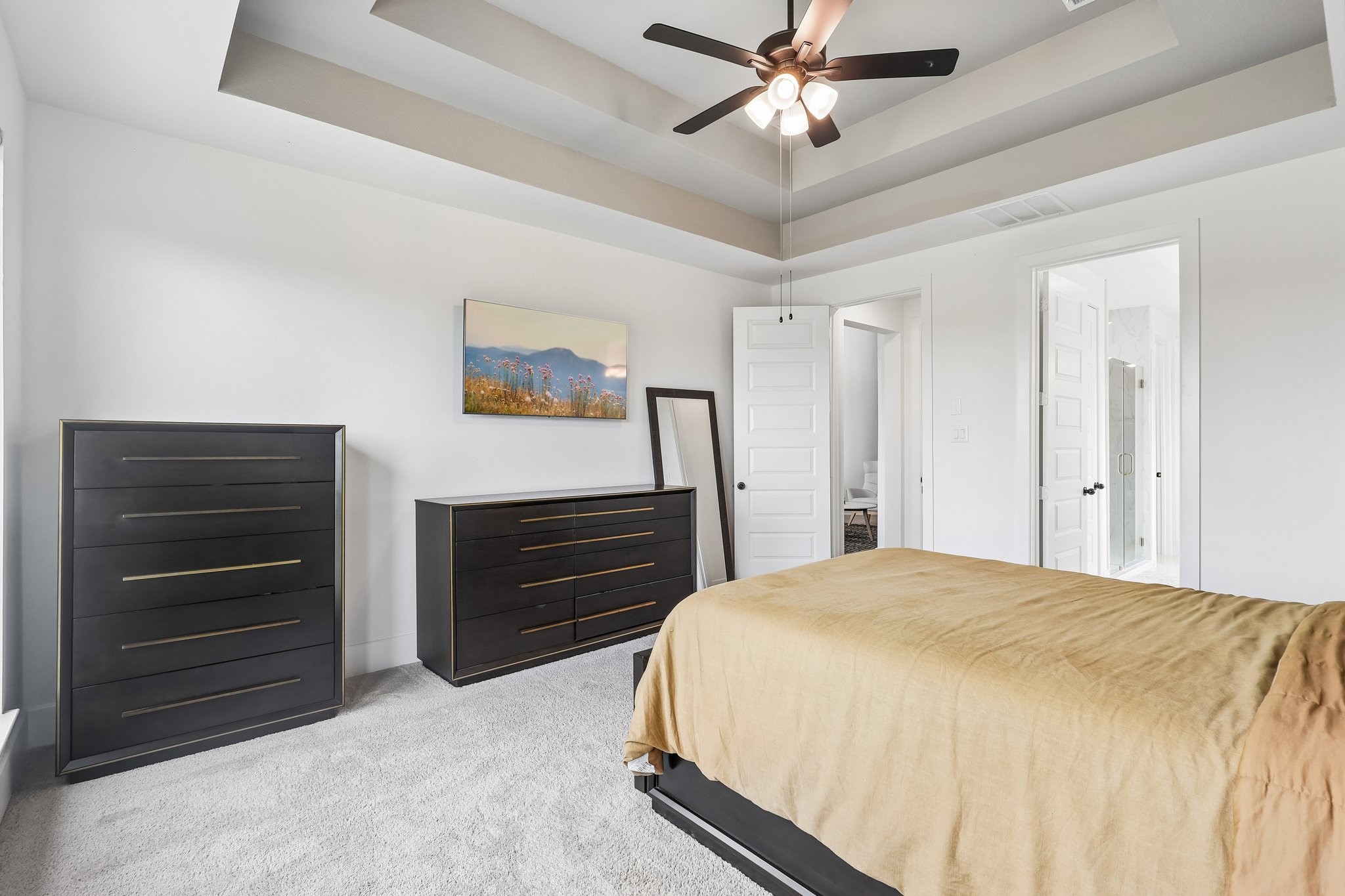 Another view of the primary bedroom