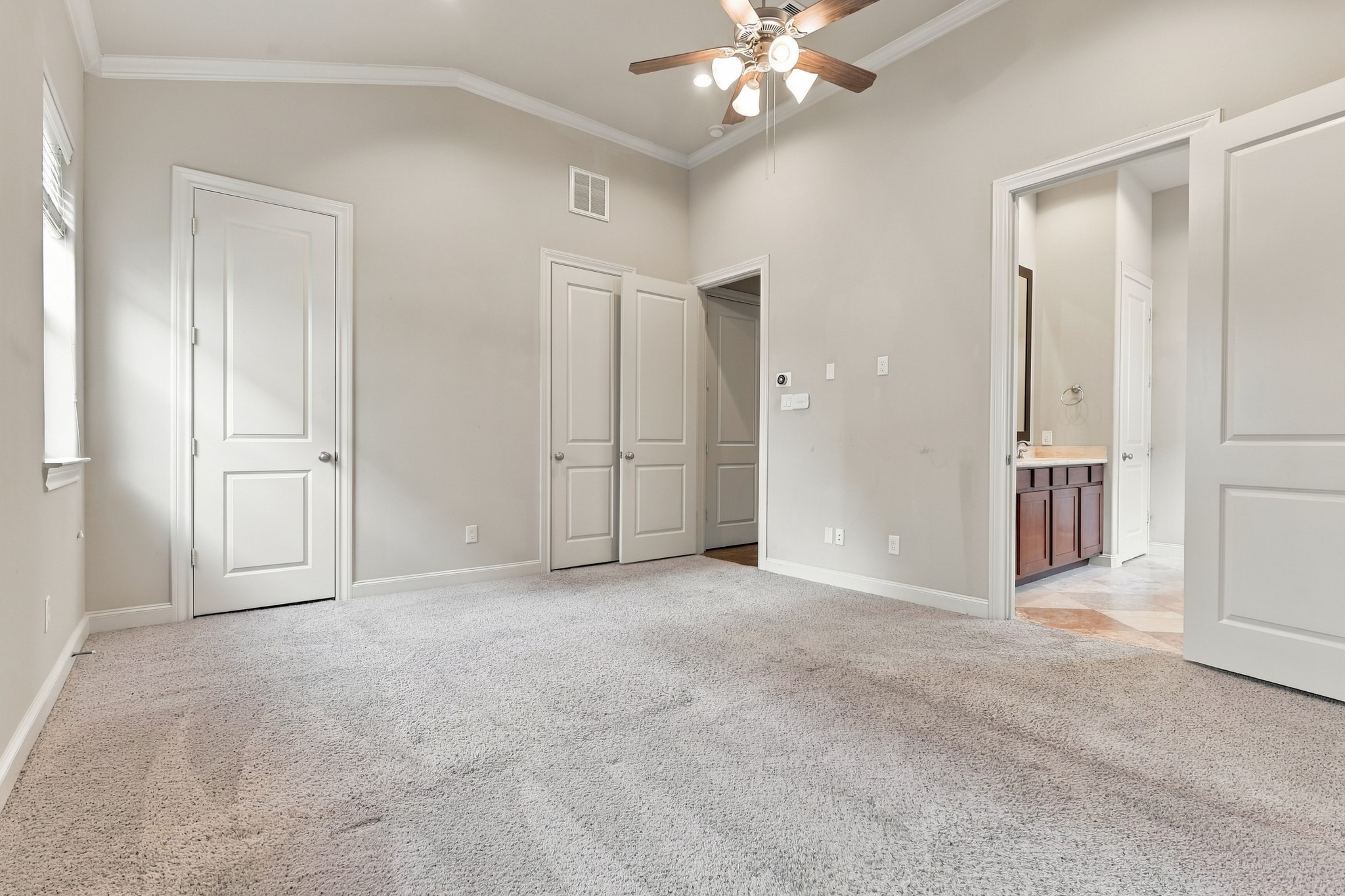 Double closets in primary bedroom.