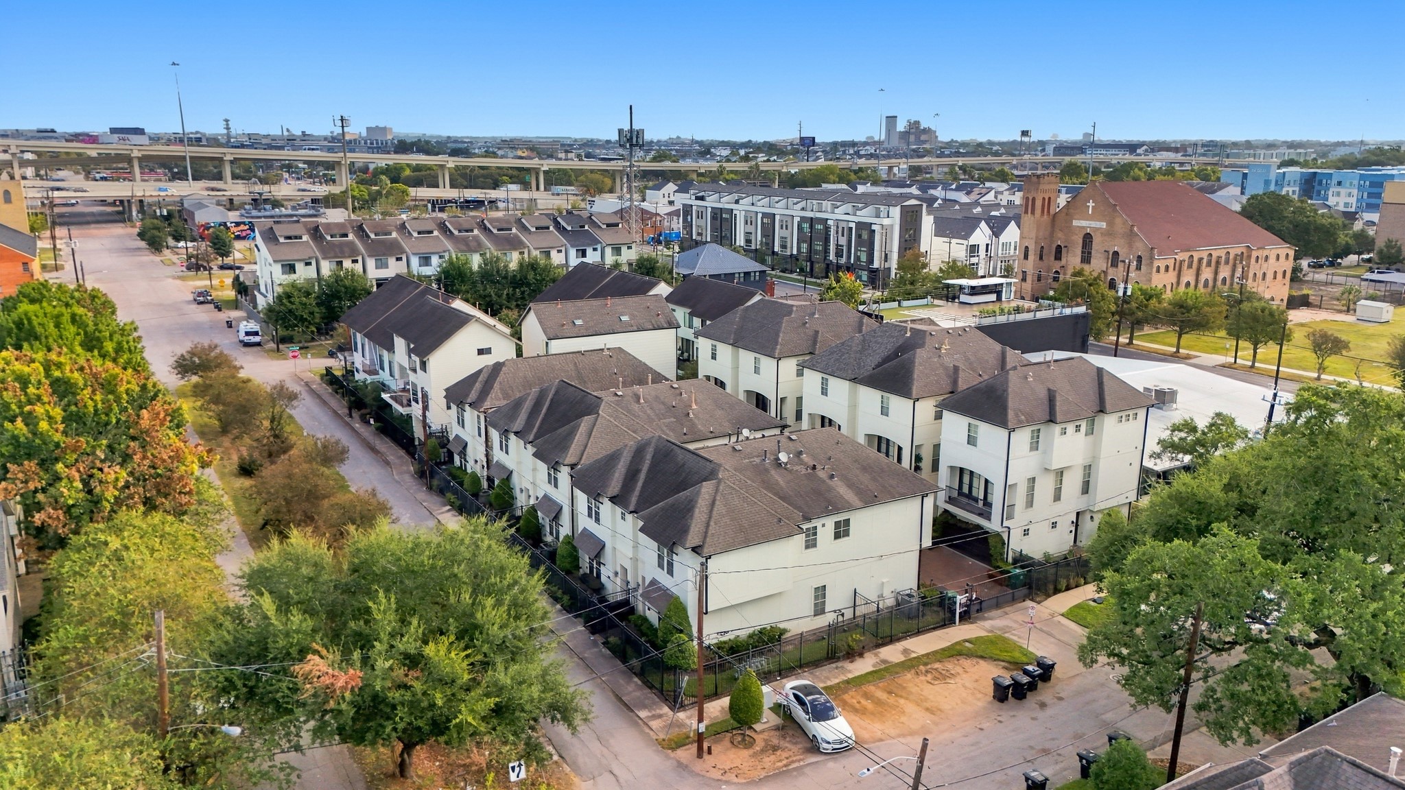 Aerial view of townhome with highways in the back.