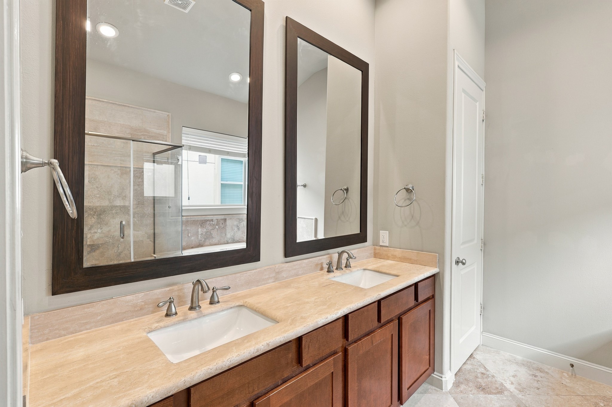 Dual vanity in primary bathroom.