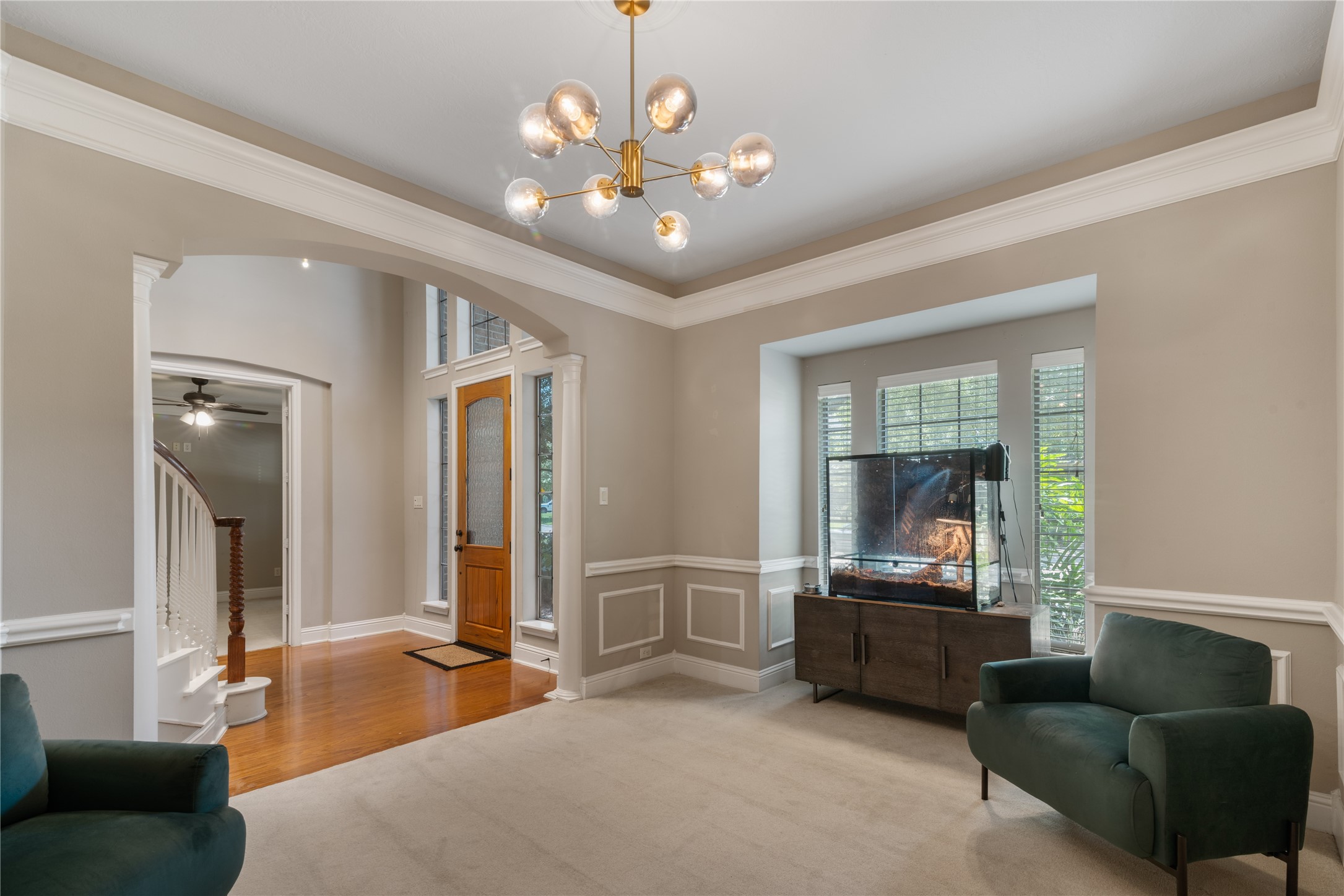 Beautiful formal dining room with decorative wall trim, contemporary lighting, and clean lines makes this room easy to personalize and perfect for hosting.