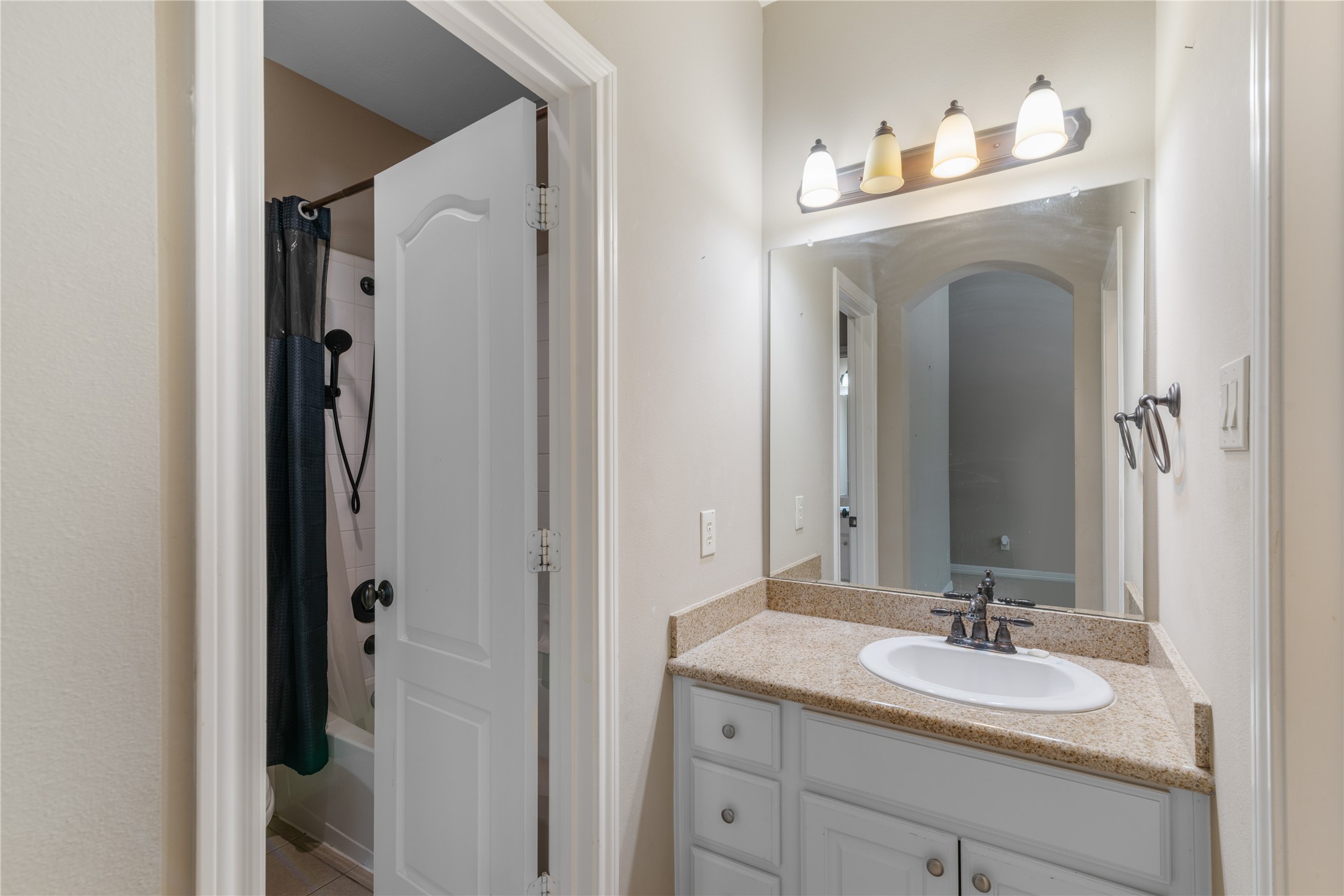Full bathroom with direct access from both adjoining bedrooms, make it ideal for family living.