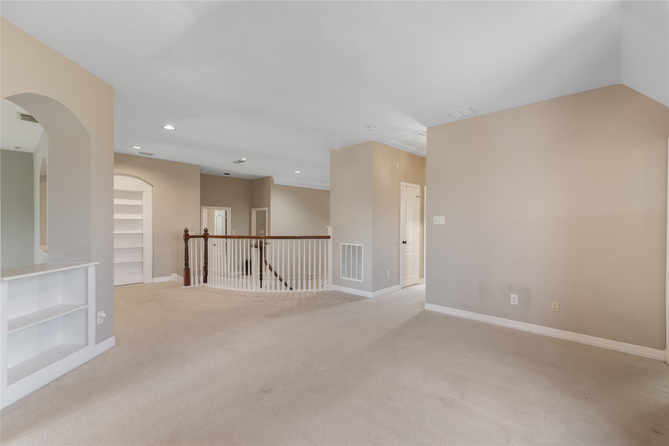 Bright and open game room upstairs provides multiple access points to secondary bedrooms and is ideal for gaming, lounging or family activies.