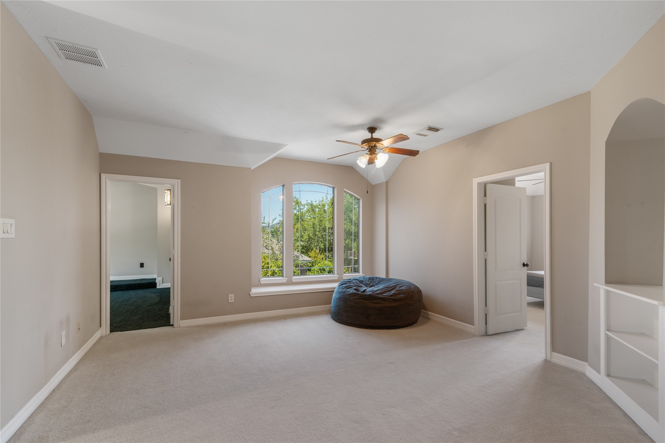 This spacious game room is a versatile space, perfect for a playroom, workout room or a second living space.