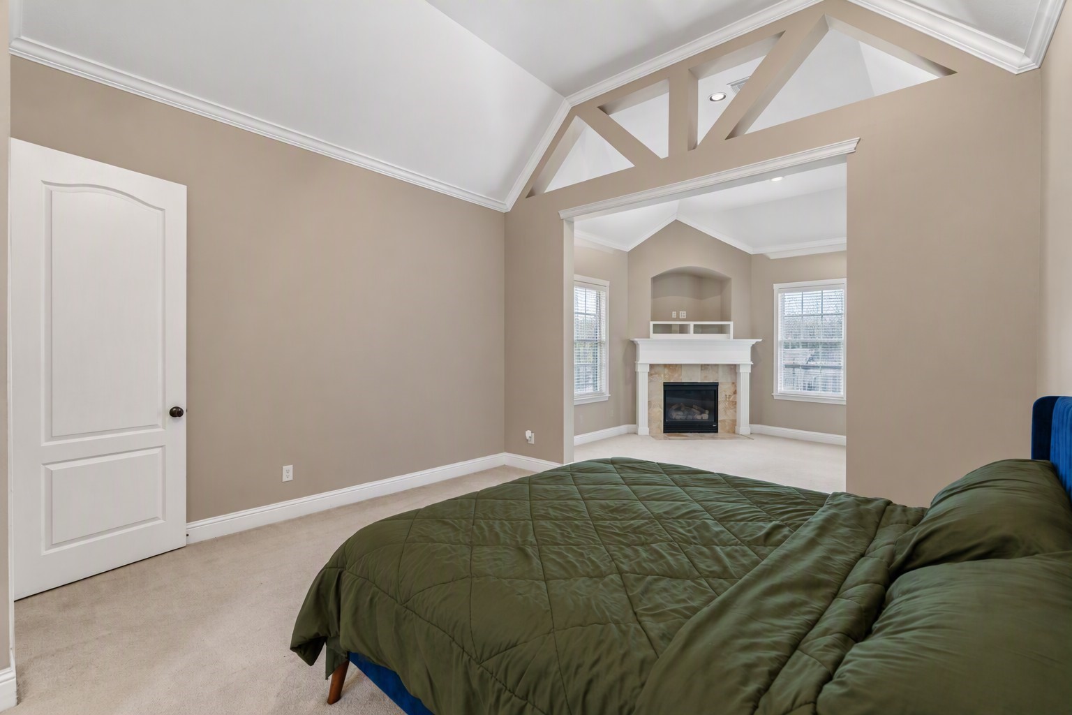 The master bedroom layout offers a relaxing space in an attached sitting room, for reading or unwinding while enjoying the ambiance of the fireplace.