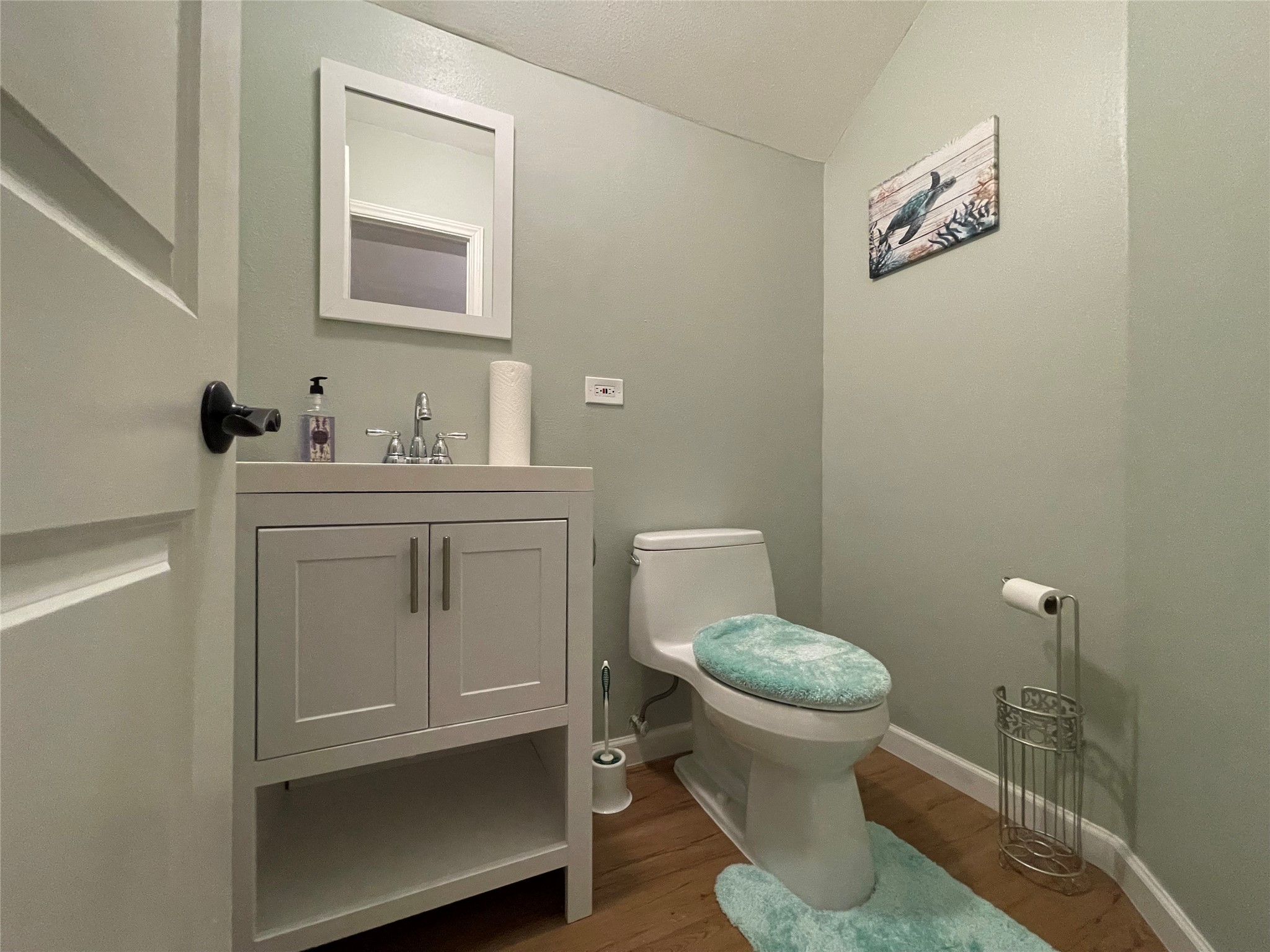 Half Bathroom in game room in garage