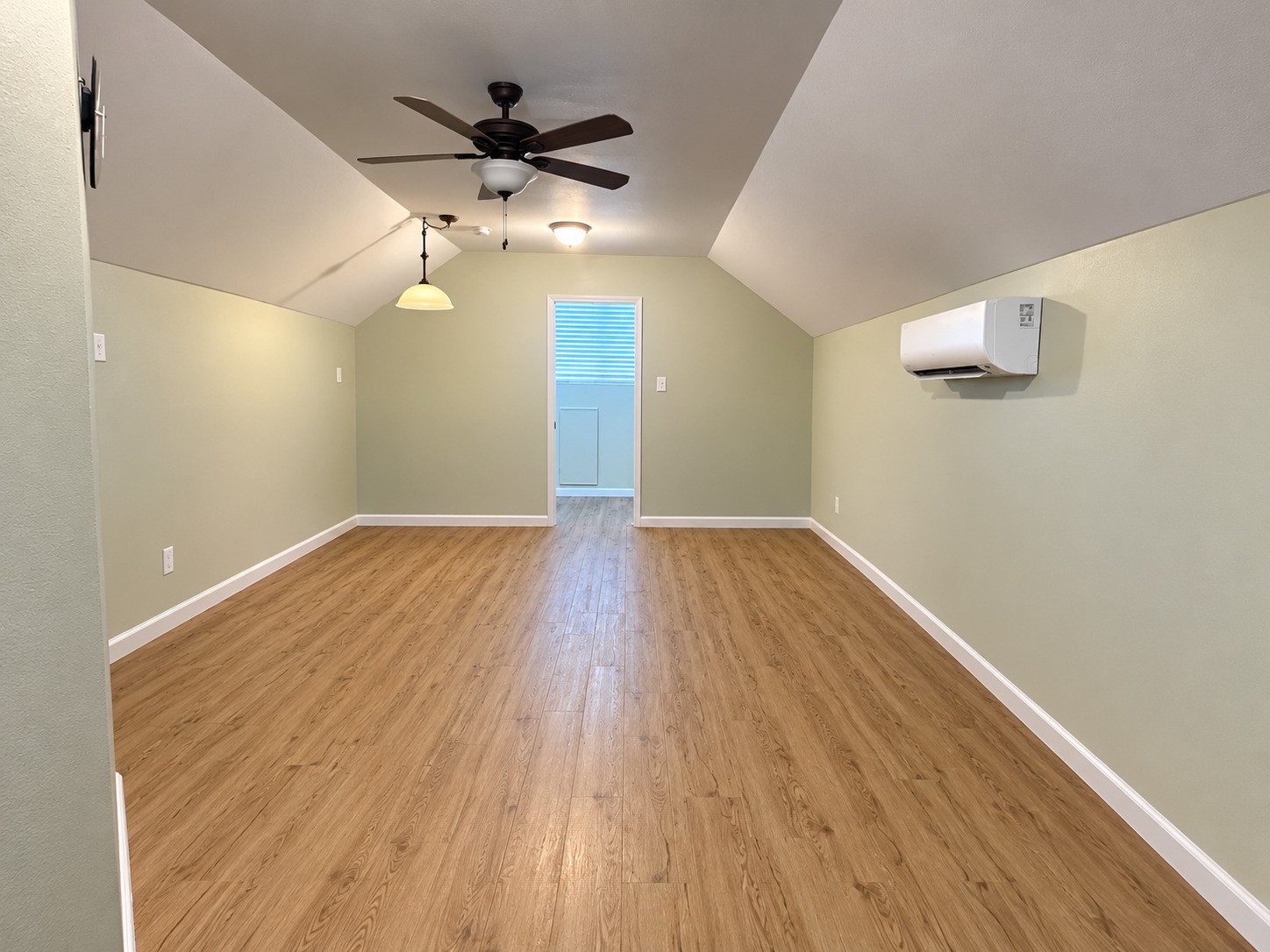 Plenty of space to relax and entertain in the game room in the garage
