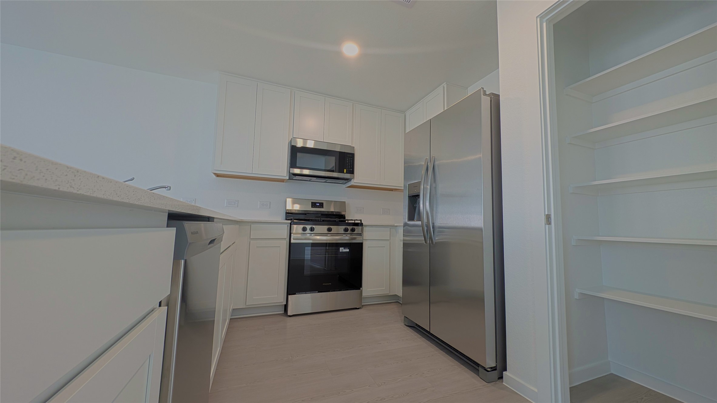 Stainless steel kitchen appliances and pantry