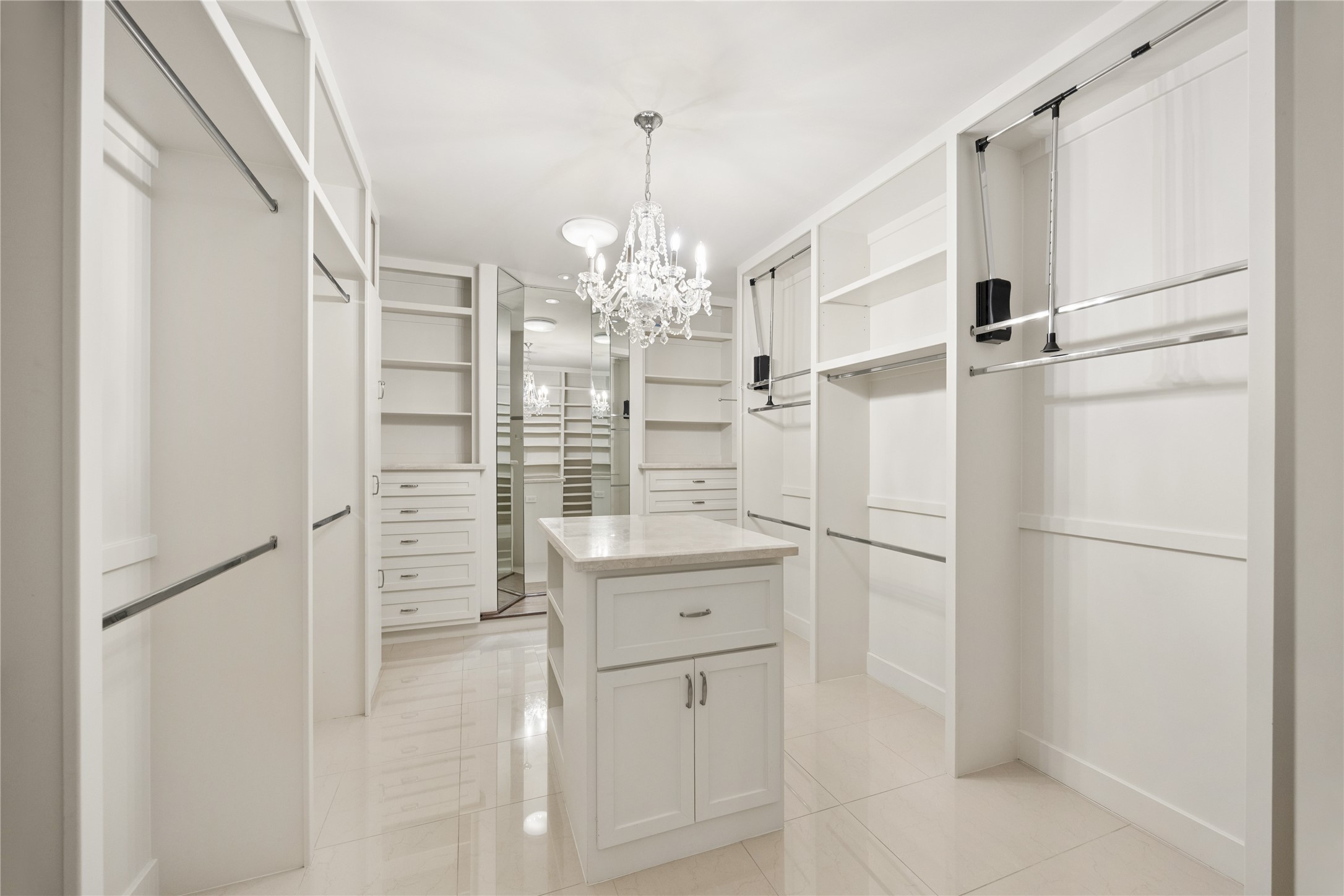 Expansive primary closet with island for packing and storage