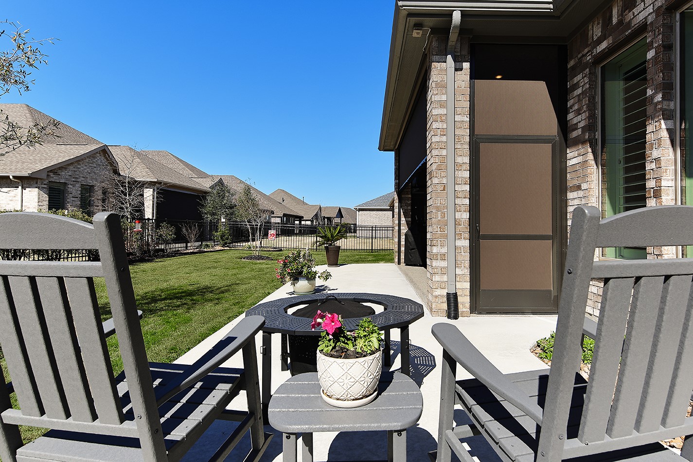 This lush lawn provides an ideal outdoor space perfect for children or pets to play.