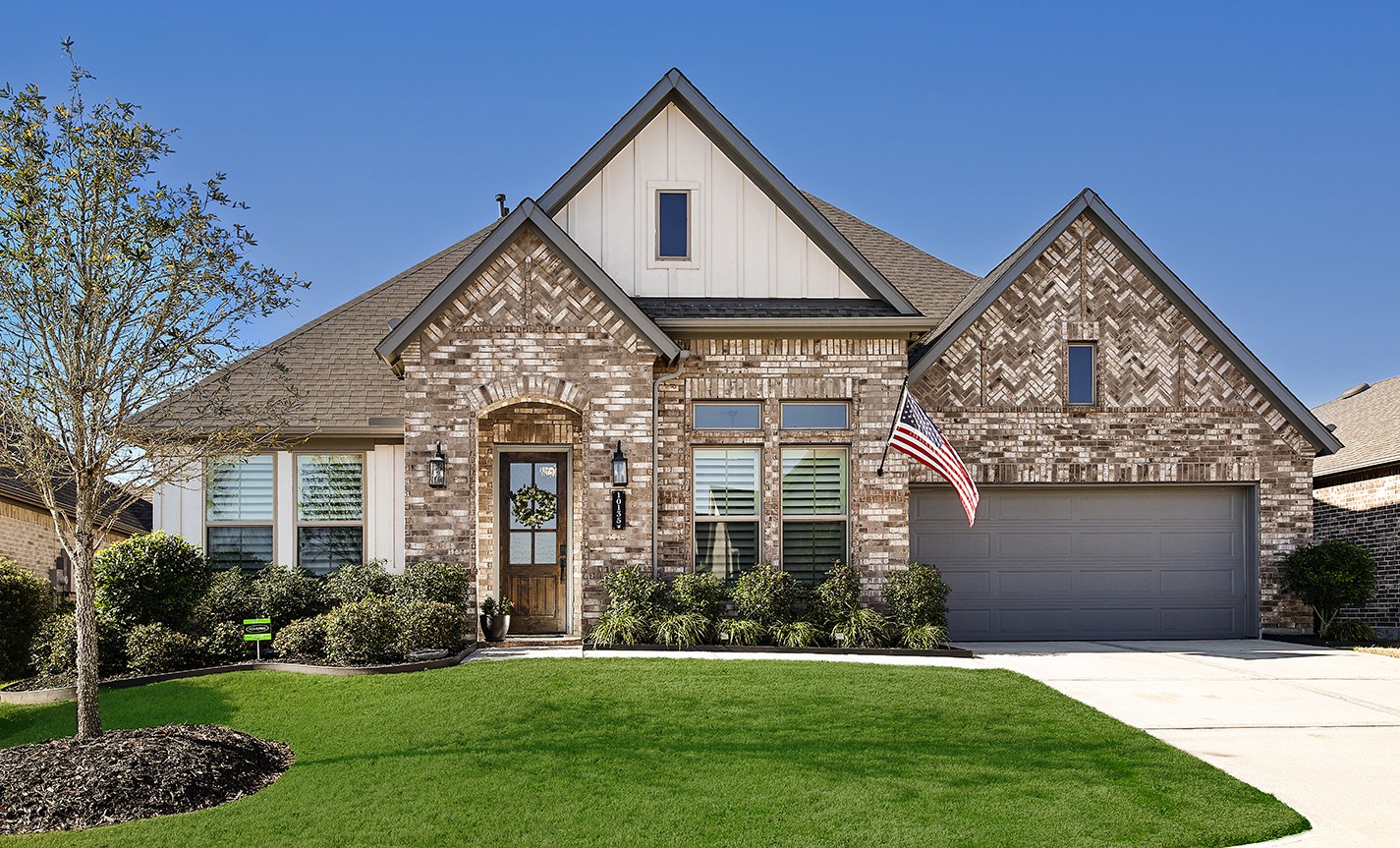 This home features a stunning, inviting exterior that combines beautiful antique brick in unique patterns with modern vertical siding, creating a sophisticated and timeless curb appeal. This home features a stunning, inviting exterior that combines beautiful antique brick in unique patterns with modern vertical siding, creating a sophisticated and timeless curb appeal.