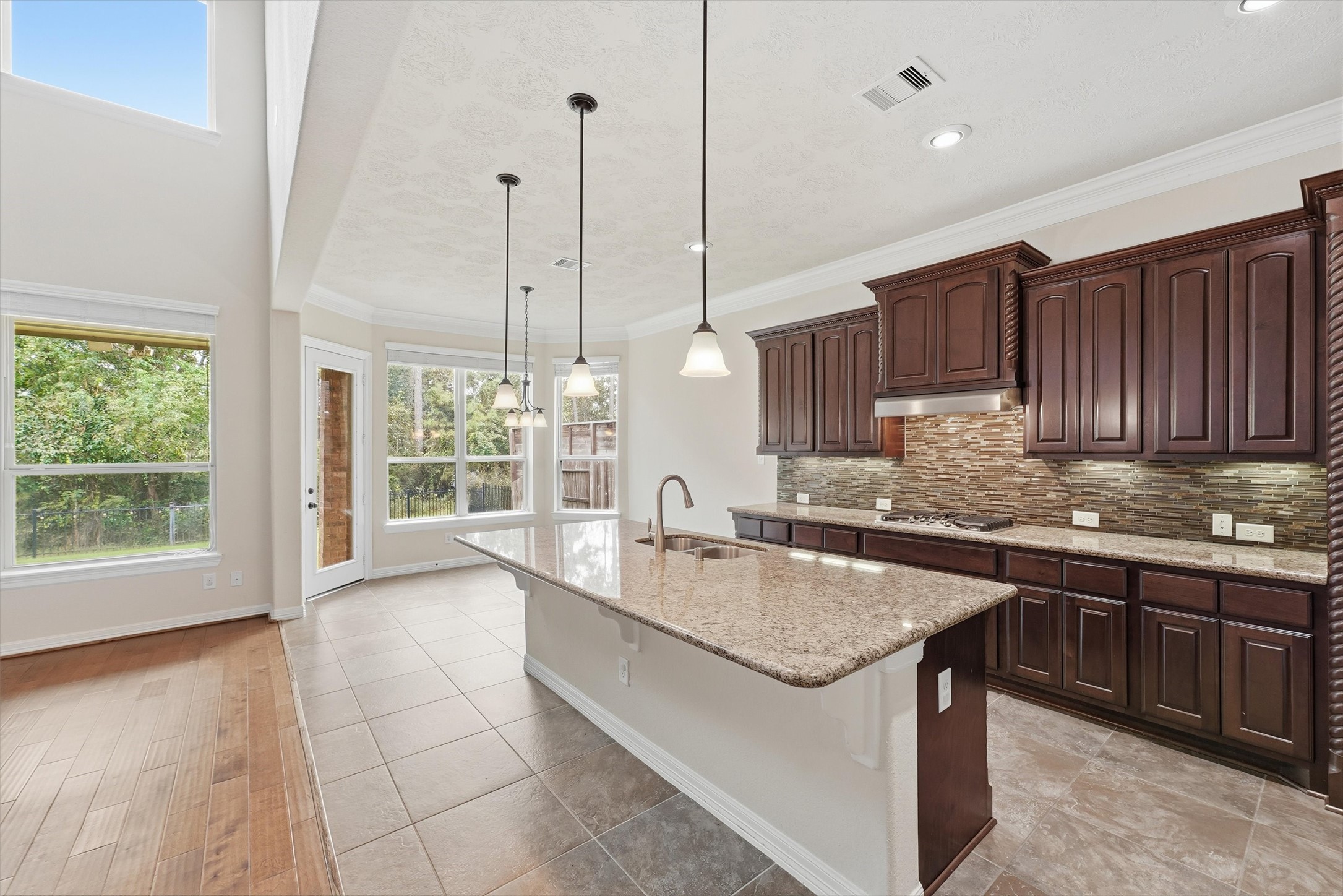 Beautifully appointed kitchen with upgraded cabinetry, and 5 burner gas cooktop.