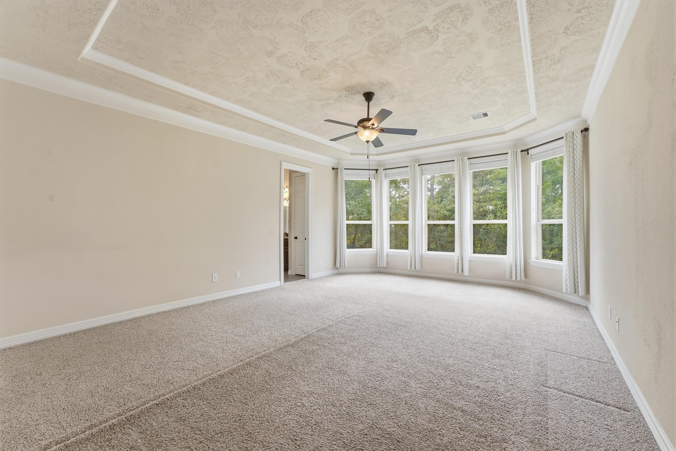 Another view of the primary bedroom