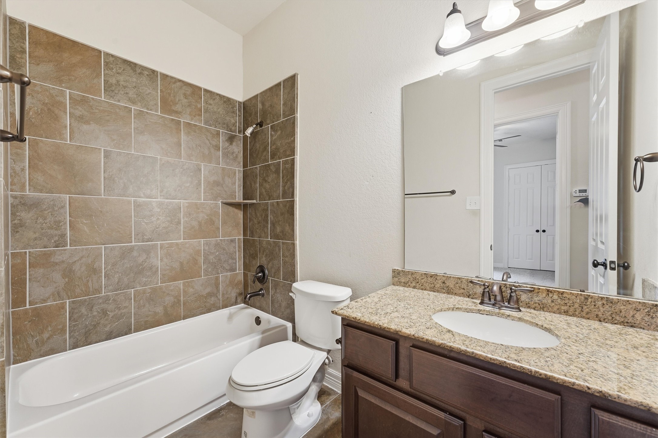 Second full bath on first level across from second bedroom