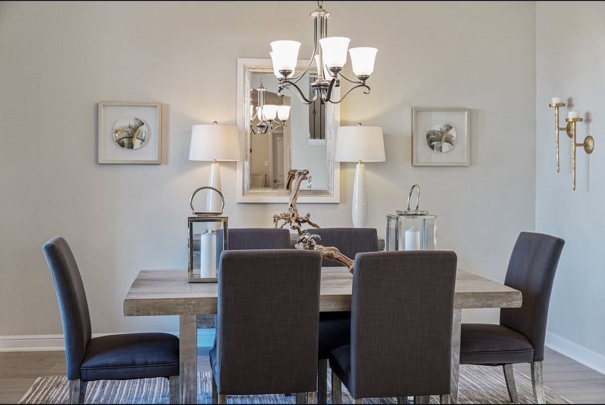 Elegant dining area featuring ambient lighting with a modern lighting.