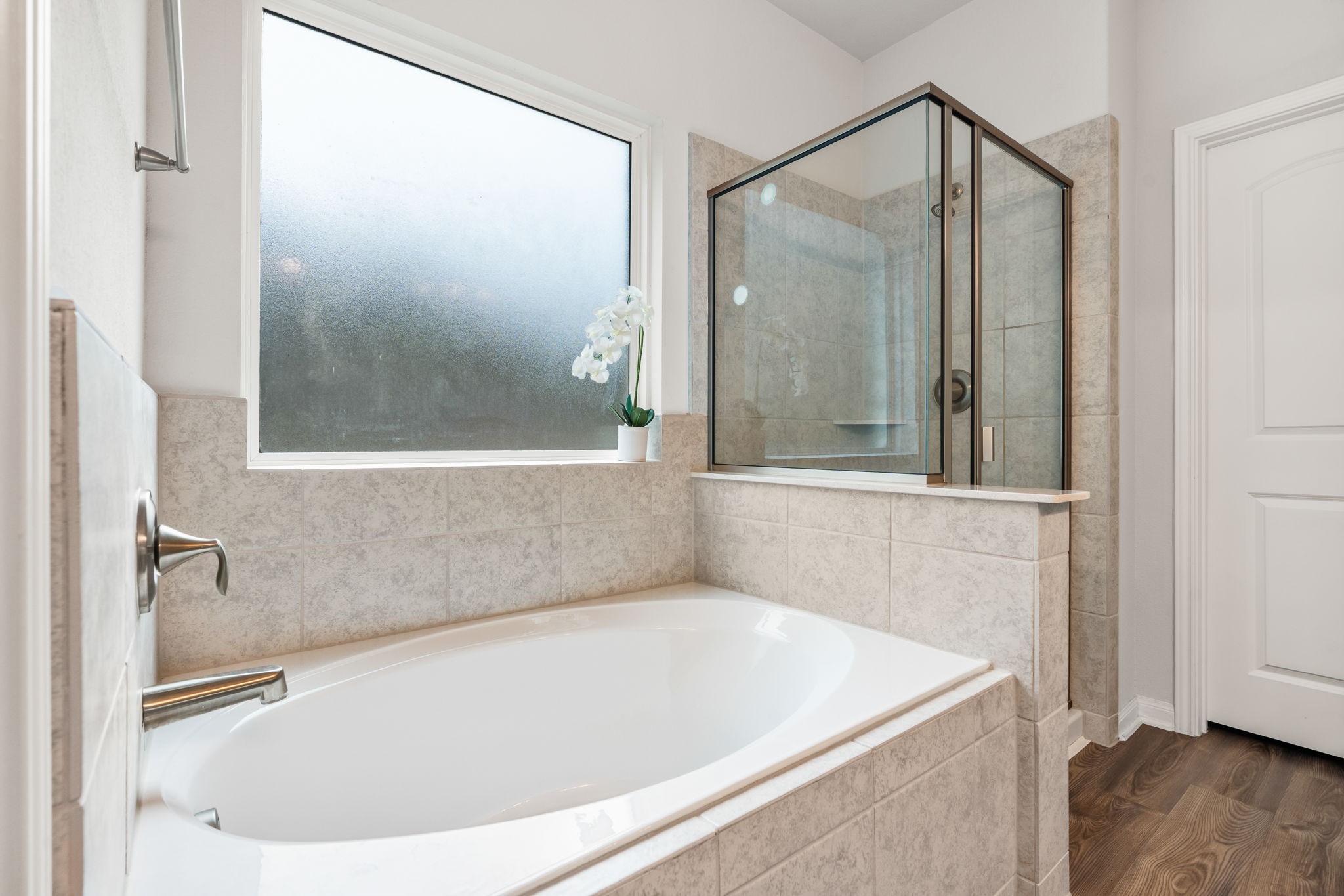 Large soaking tub with separate shower.