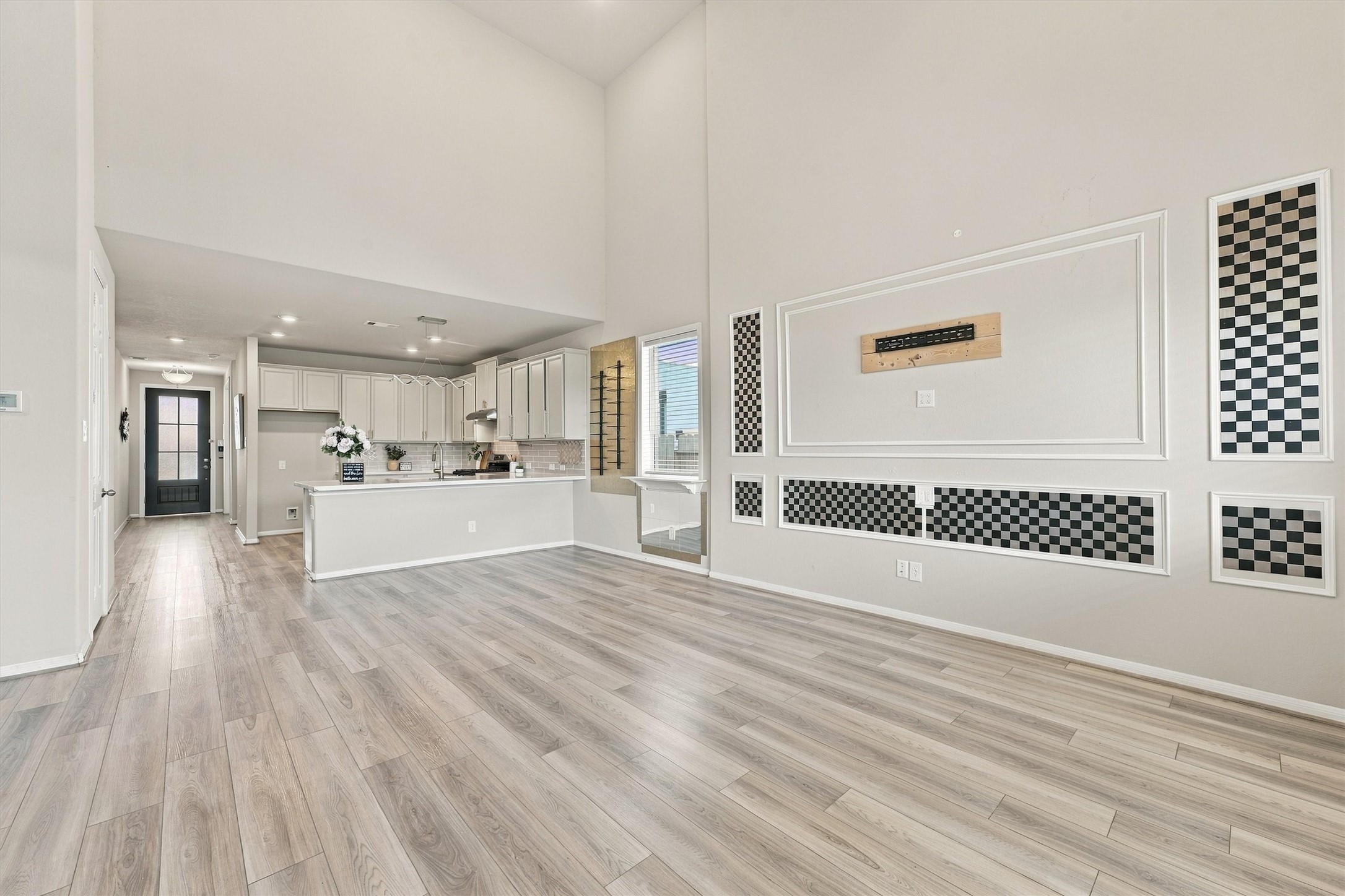 Open-concept dining and kitchen flow seamlessly into the living room.