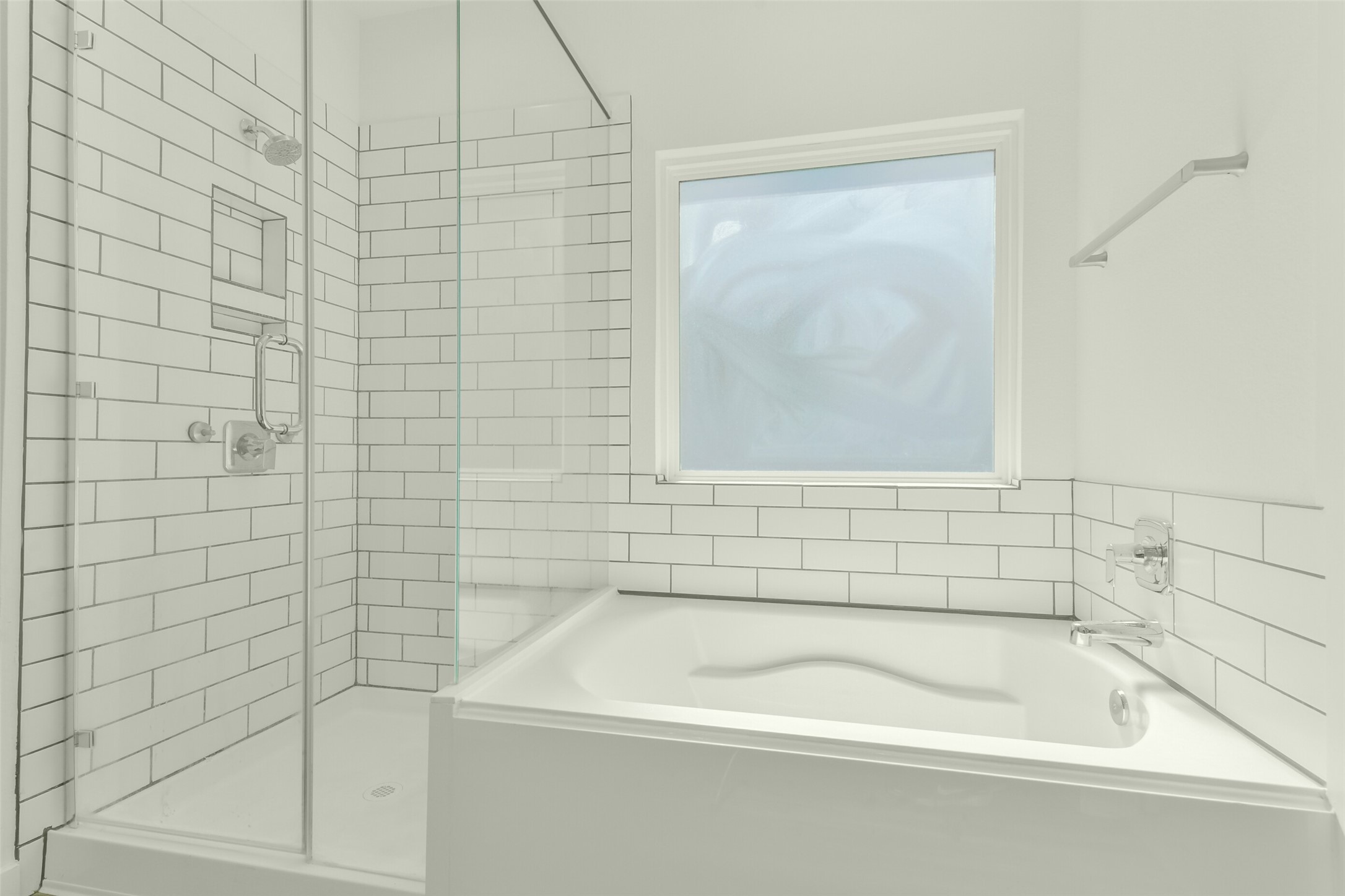 separate shower and tub in primary bathroom.