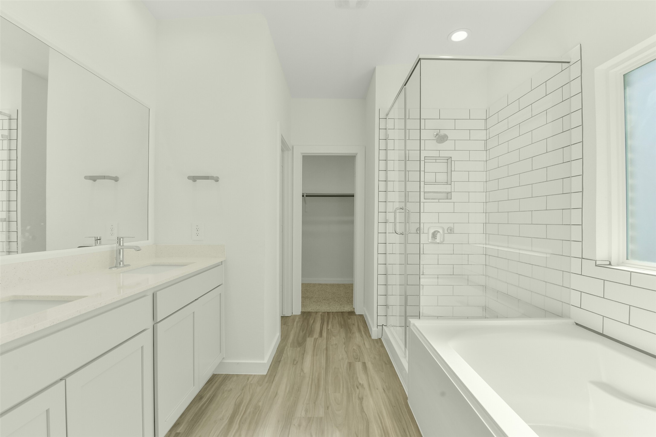 Primary bath boasts separate shower and tub, plus huge walk in closet. Primary bath boasts separate shower and tub, plus huge walk in closet.