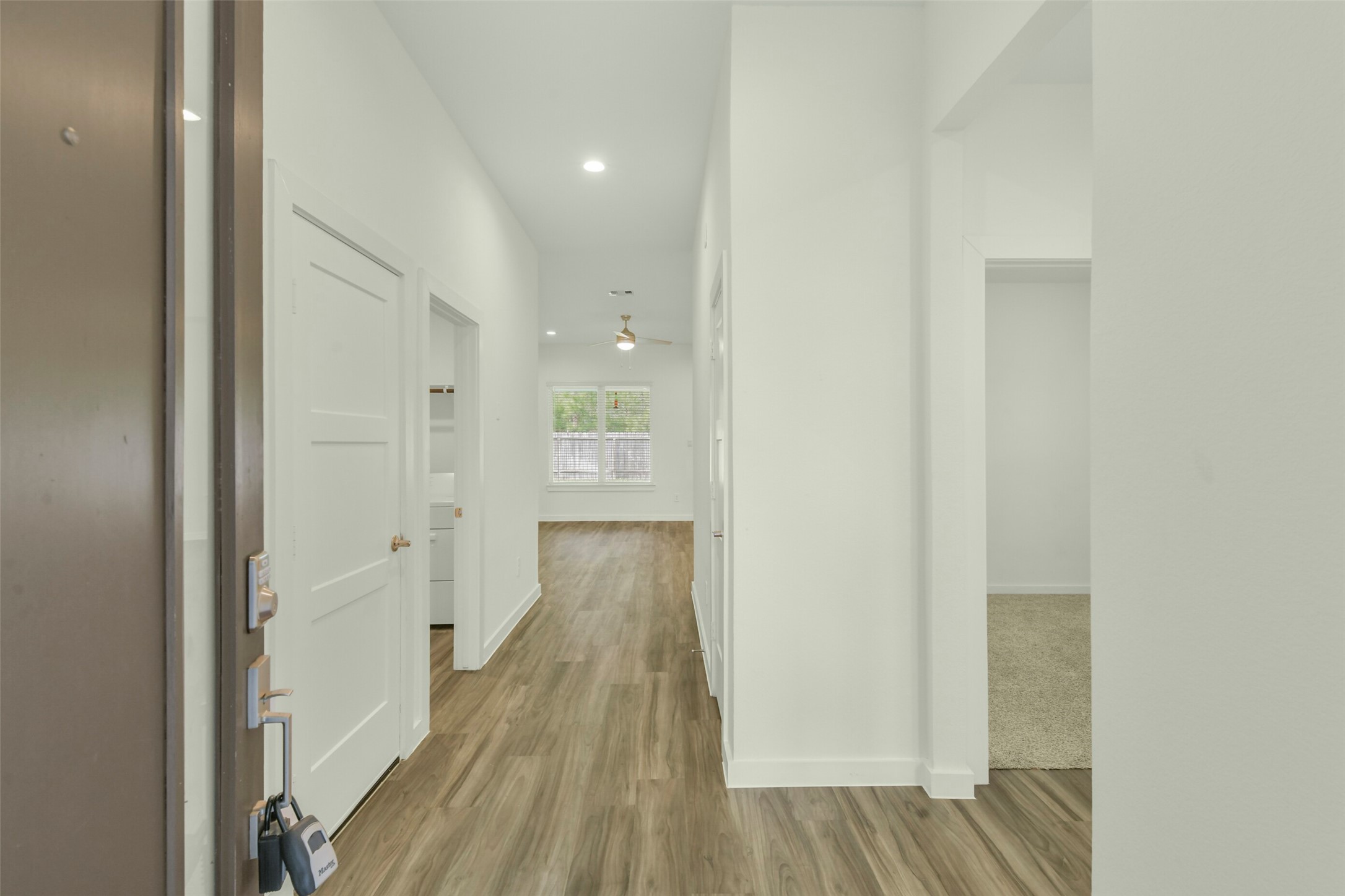Clean entry with vinyl plnk flooring.