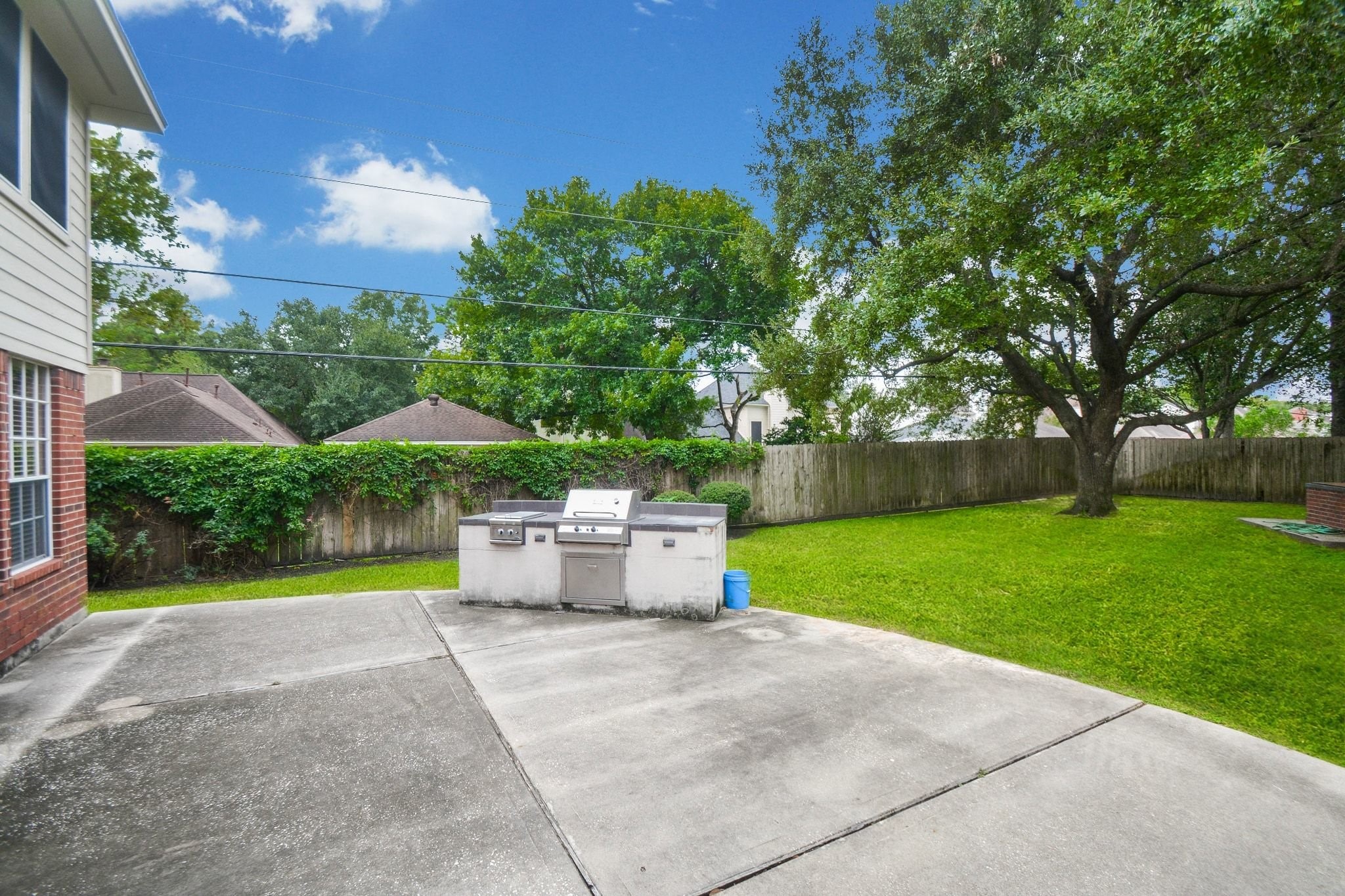 Extended patio decking and outdoor kitchen/grill area