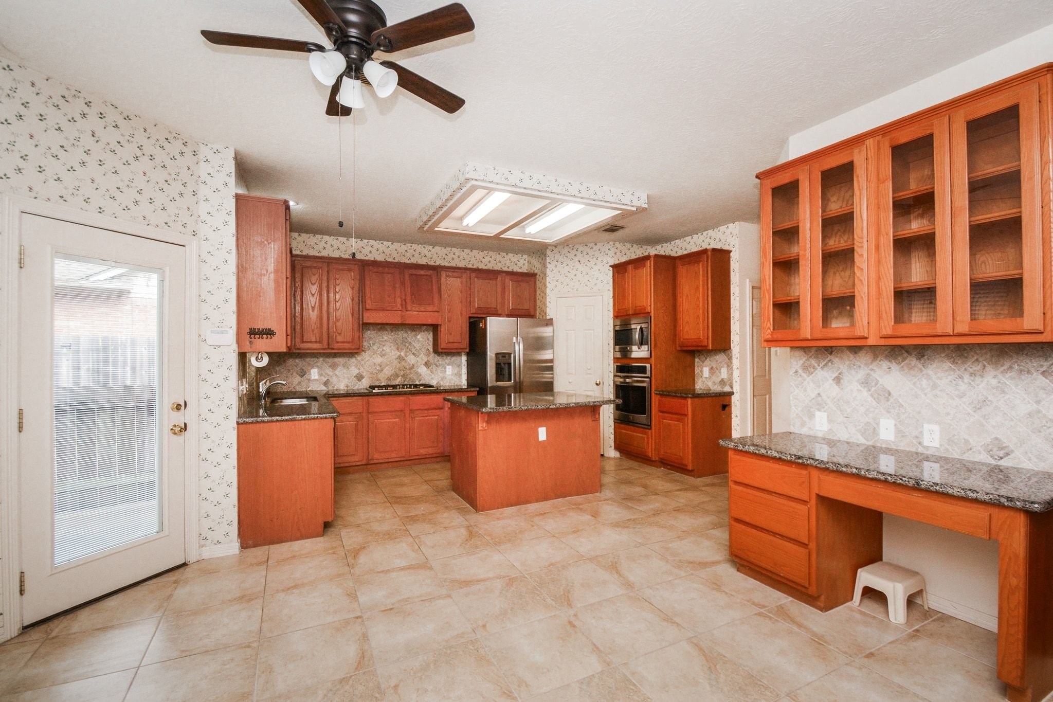 Open concept kitchen with desk area