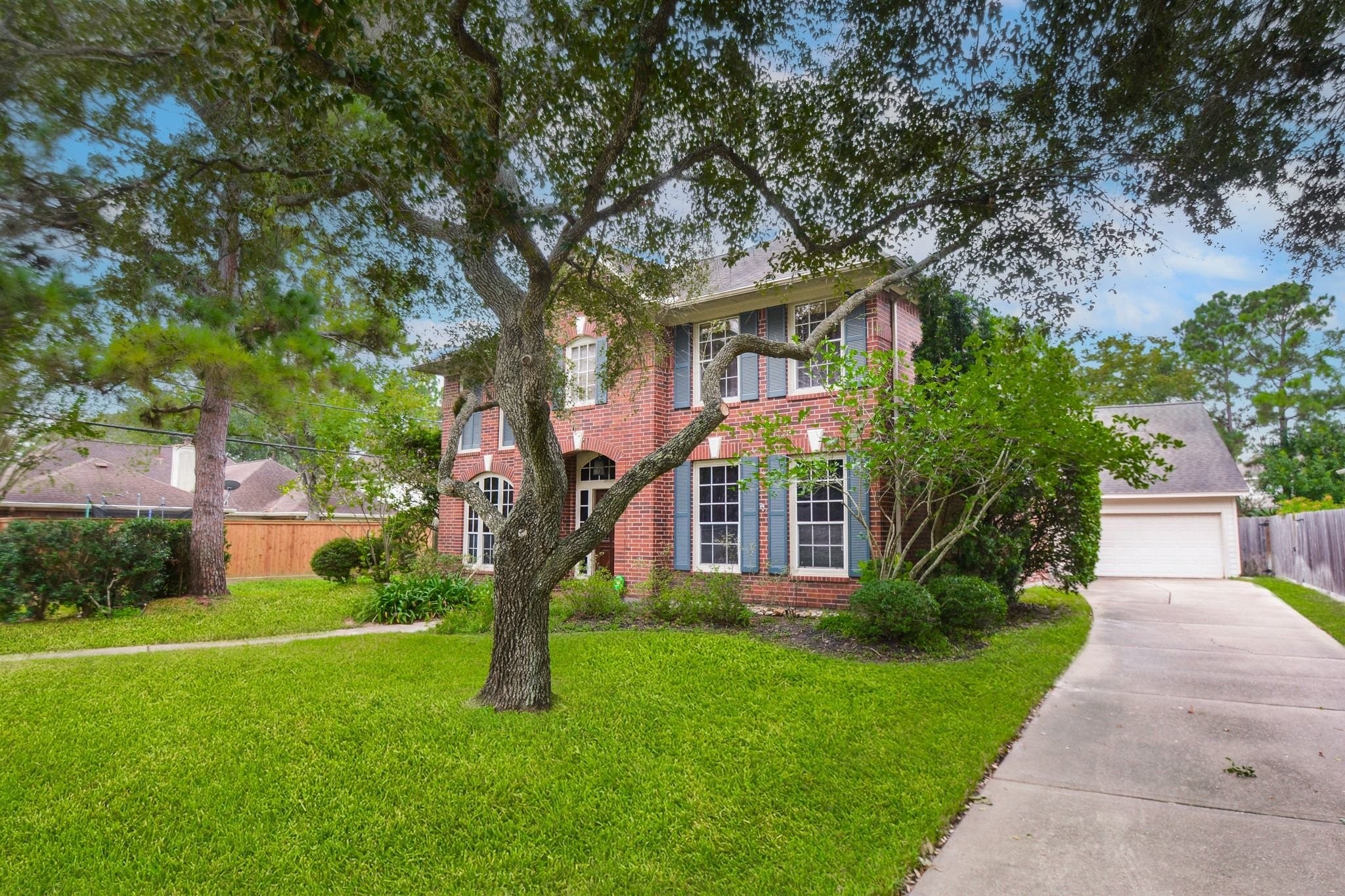 Home features a long driveway and a detached oversized garage with full hvac system Home features a long driveway and a detached oversized garage with full hvac system