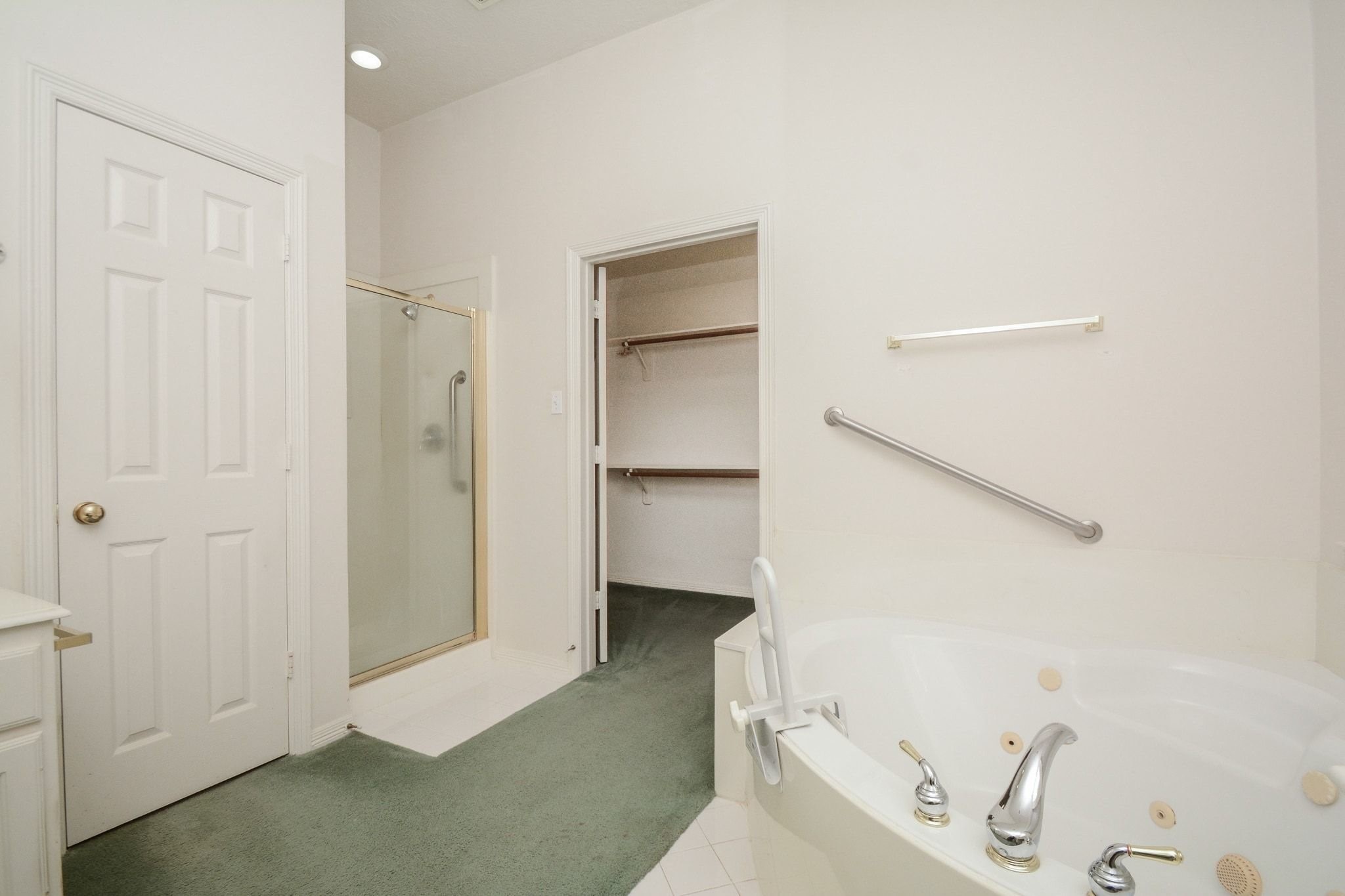 Primary bathroom also features a walk in closet