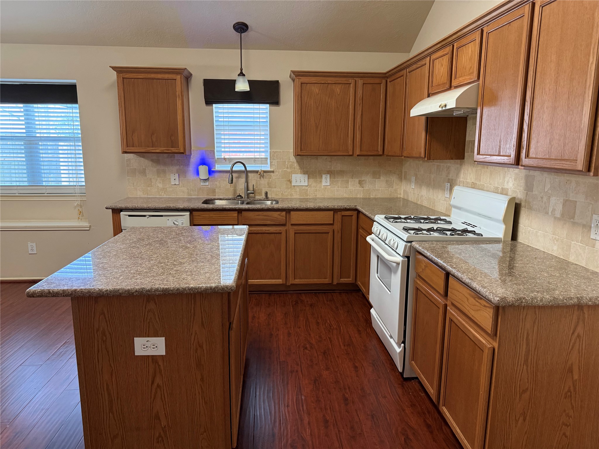 Step into this inviting home and discover a spacious island kitchen, perfect for culinary adventures and entertaining.