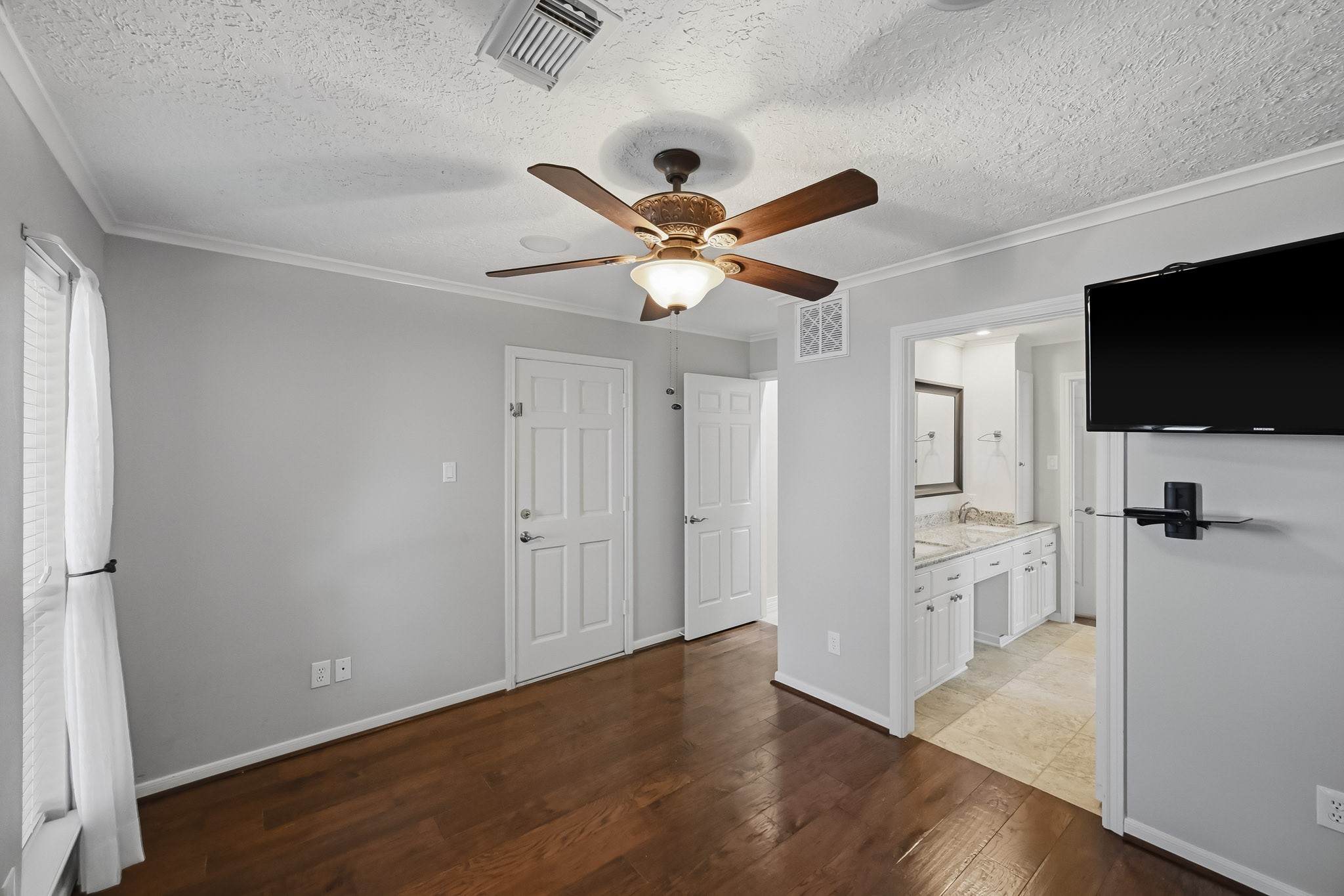 This bedroom offers a flexible layout, generous closet space and convenient access to the adjoining bathroom.