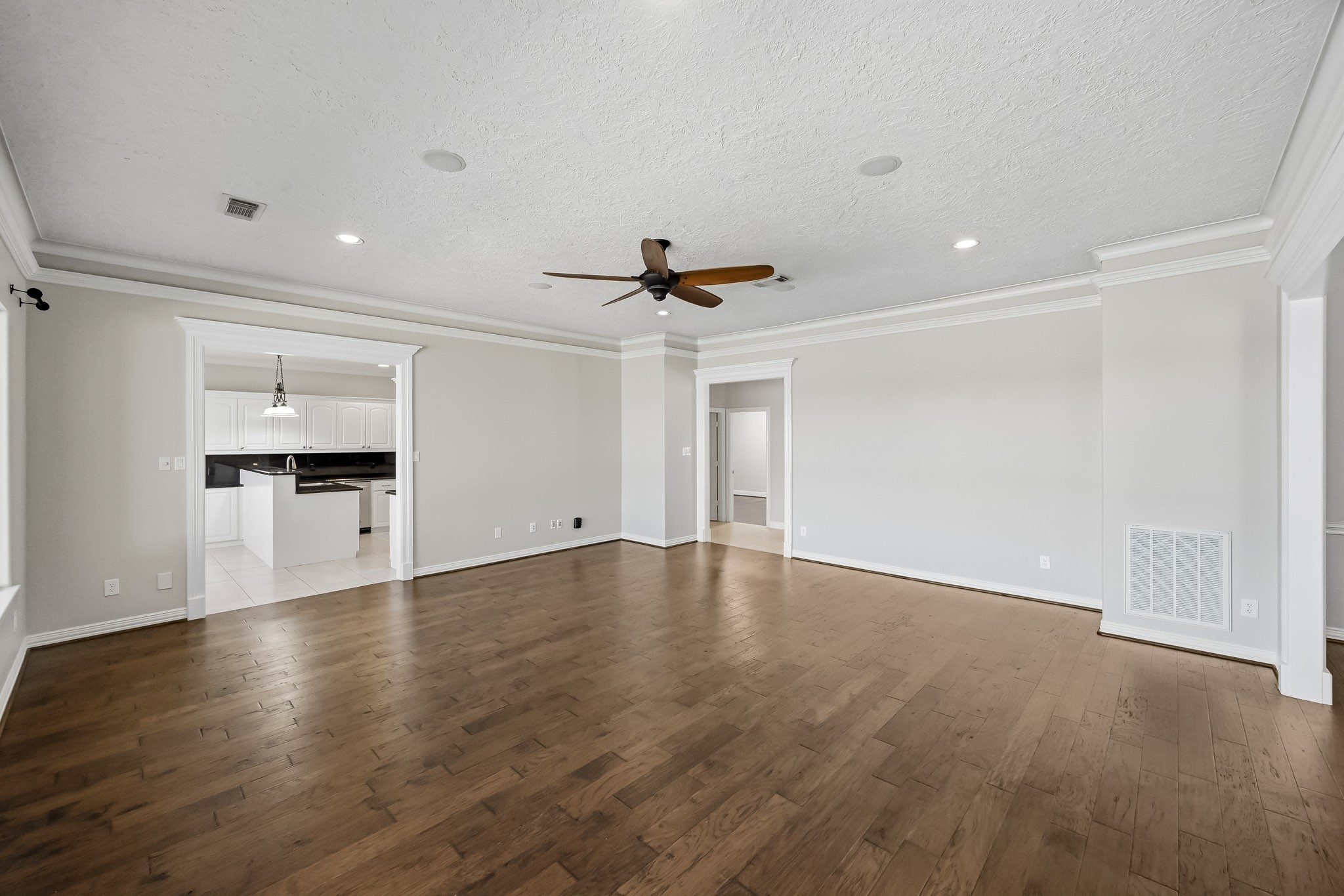 An open connection to the formal dining room and convenient kitchen access create an easy, functional flow for everyday living.
