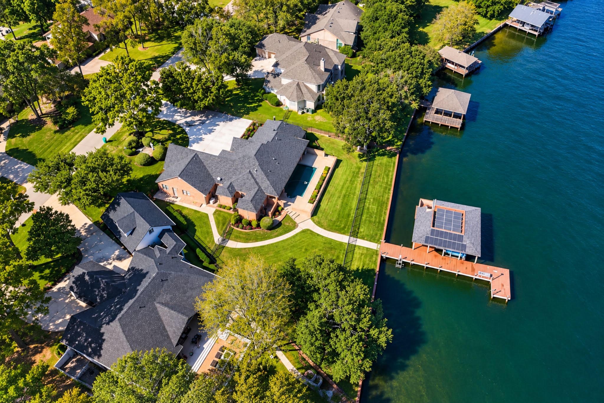 Gated, on the lake, with a boat house, a pool, and generator. Your luxury hideaway is calling.
