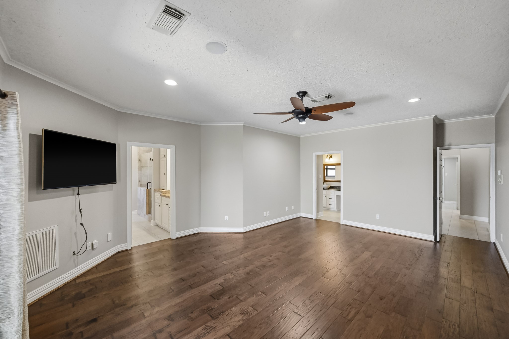 A standout feature of this primary suite is its TWO separate bathrooms, offering exceptional convenience and flexibility.