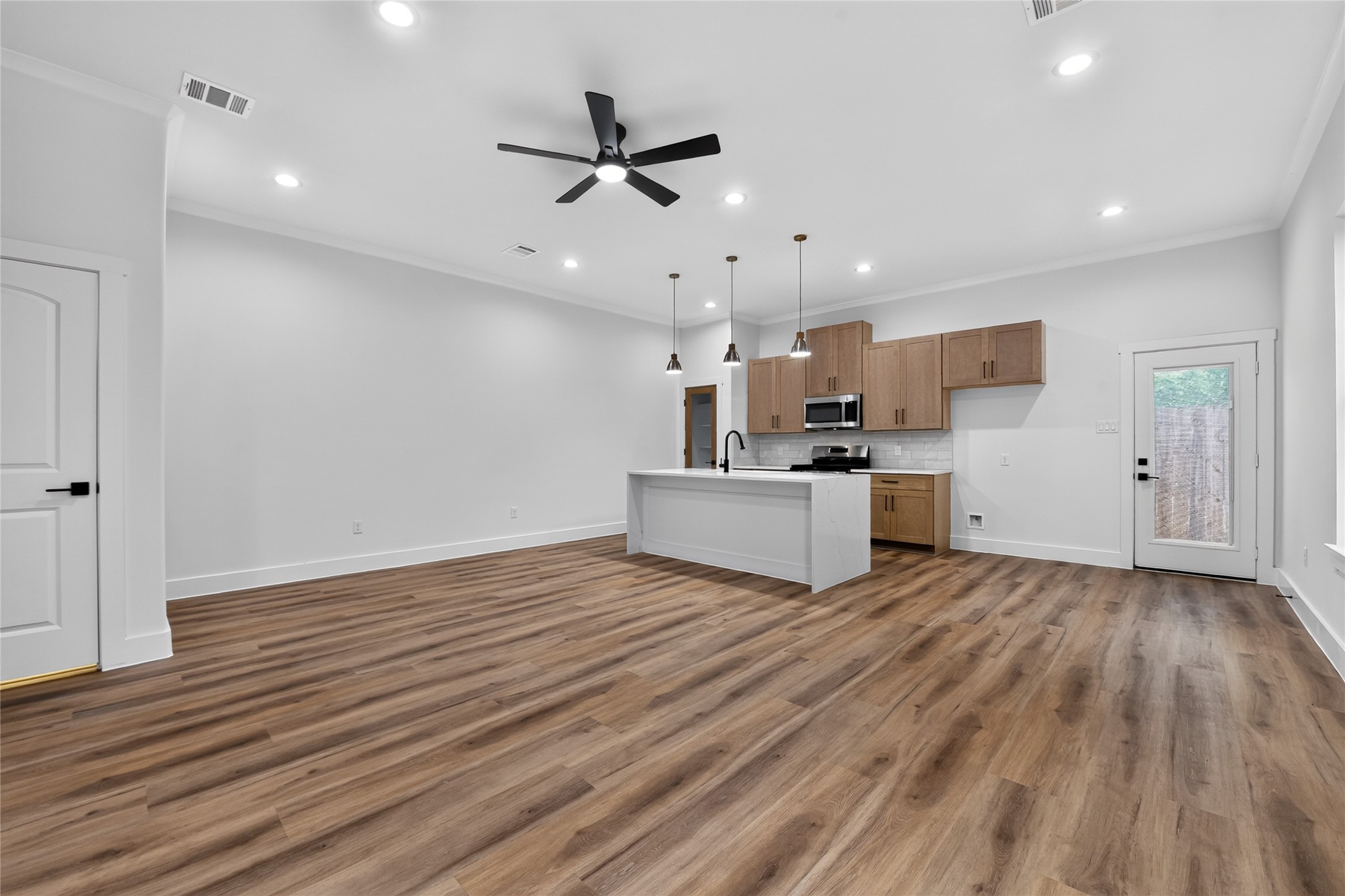 Enjoy seamless flow between the kitchen, living, and dining areas, with a convenient pantry for added storage. Clean, modern, and carpet-free throughout.