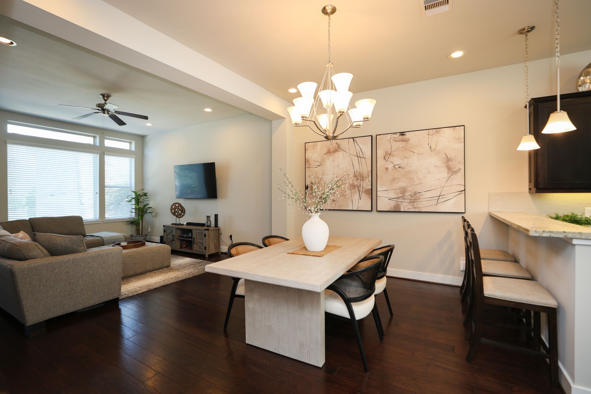 View of the dining room, with room for an 8 person table and bar stools. Home is made for entertaining and has a large, peaceful feel.