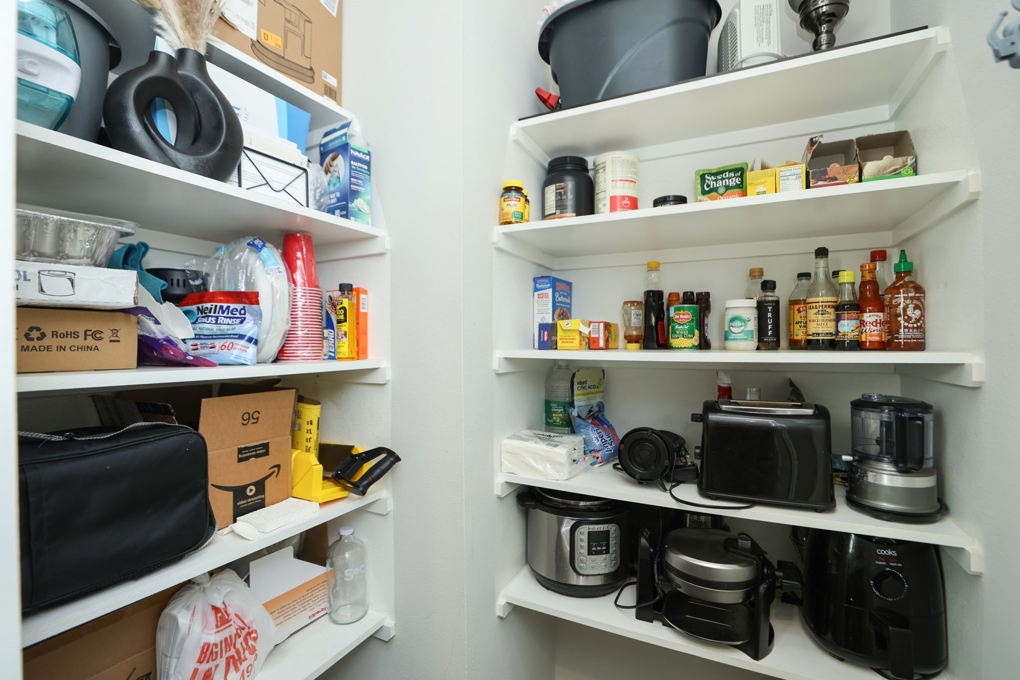 Home has a full pantry with room for food and appliances.