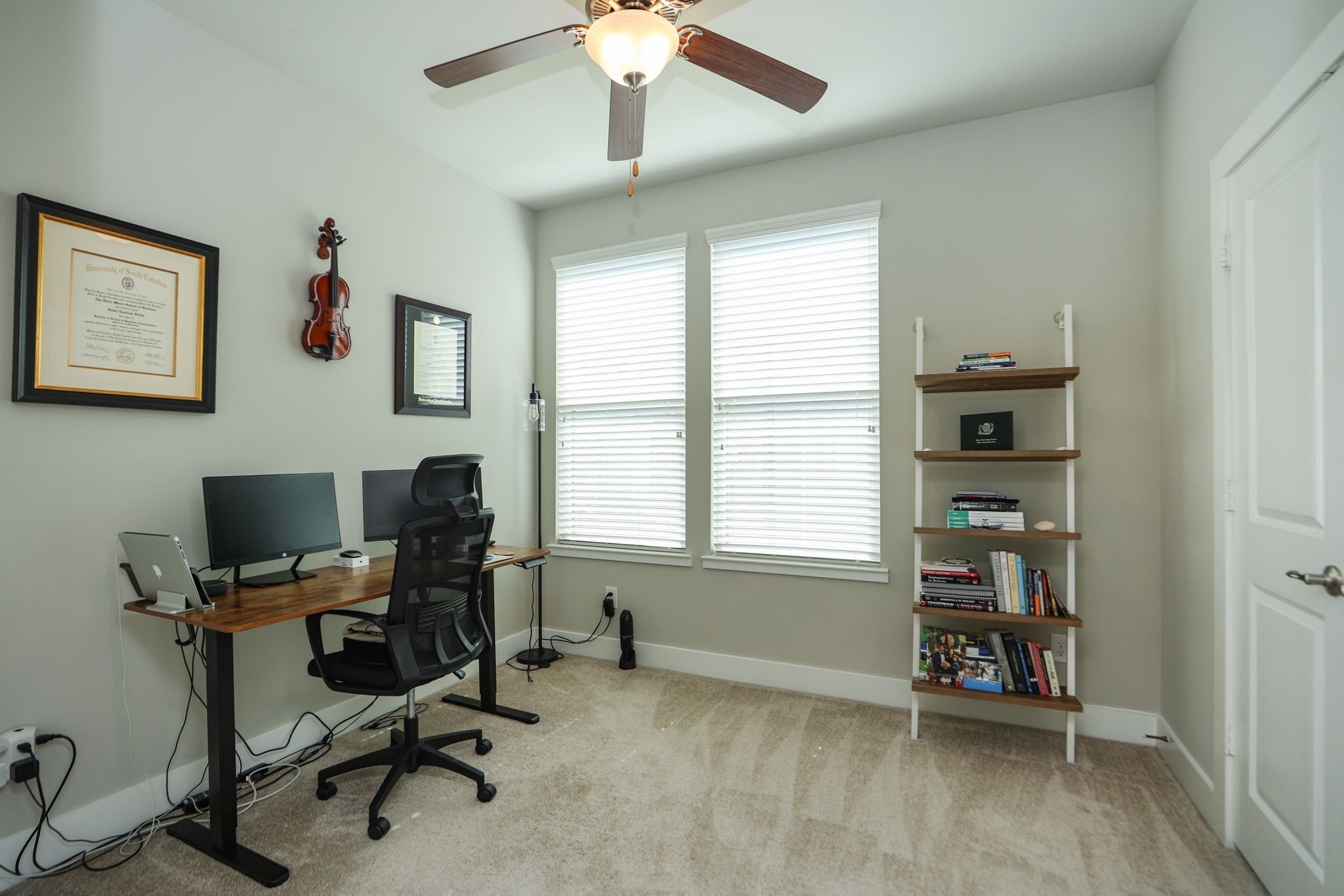 Third bedroom also has a large closet and a private bath. Currently used as an office, looks out over the rear gated drive and dog park with pergola.