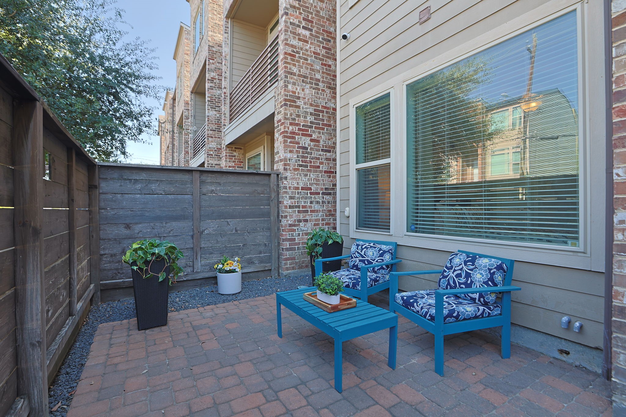 Enter the gate to find your private patio, perfect for relaxing with morning coffee, or look out over the trees towards the Hike and Bike Trail and the MKT!