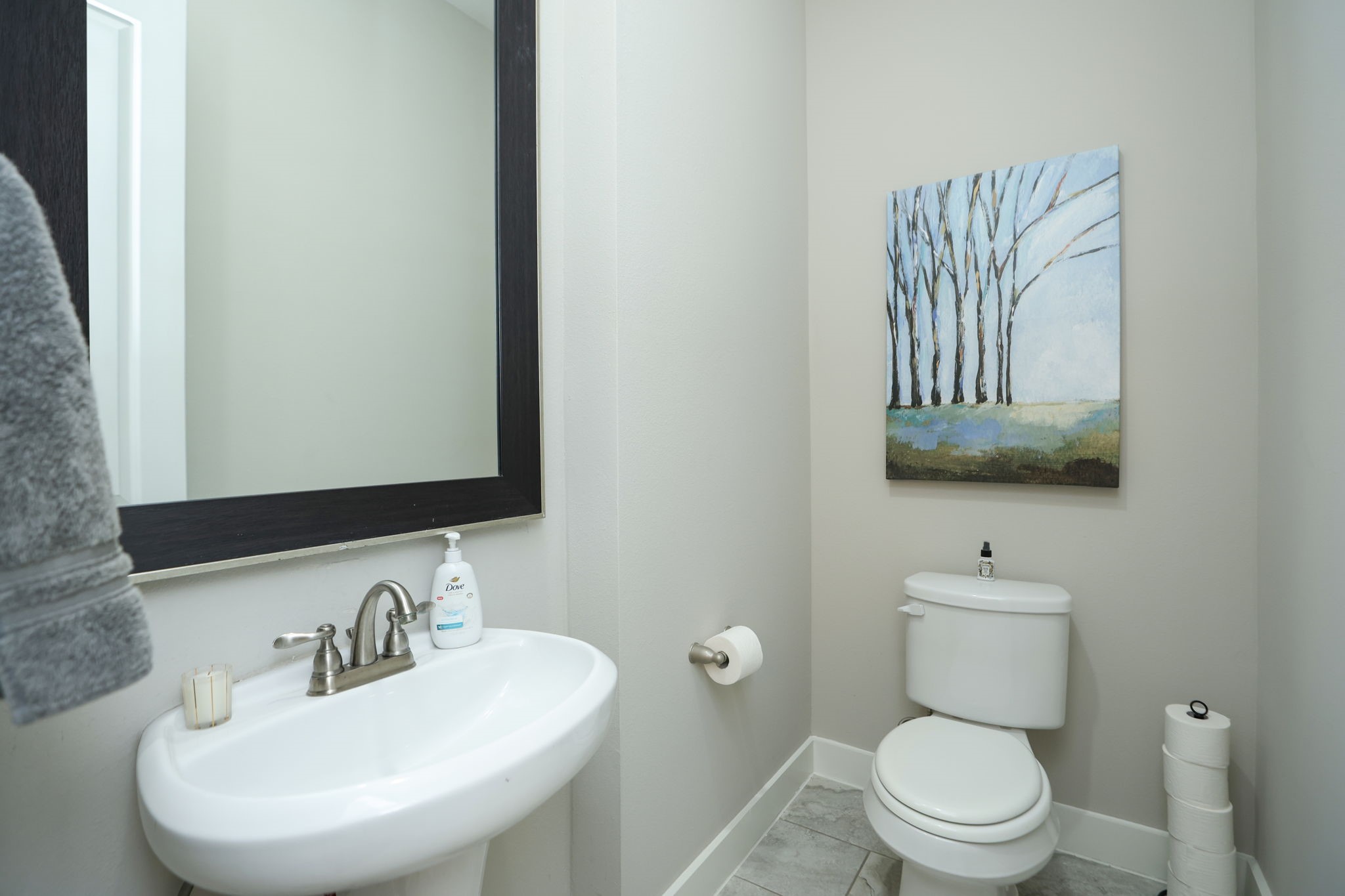 Guest bath on 2nd floor is tucked in at the top of the stairs.
