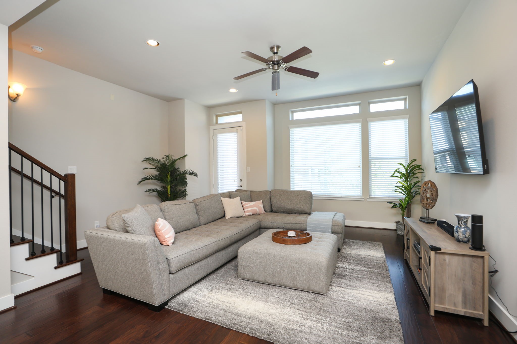 Welcome to your spacious living room with lots of light and transom windows! Door to the left goes to your balcony!