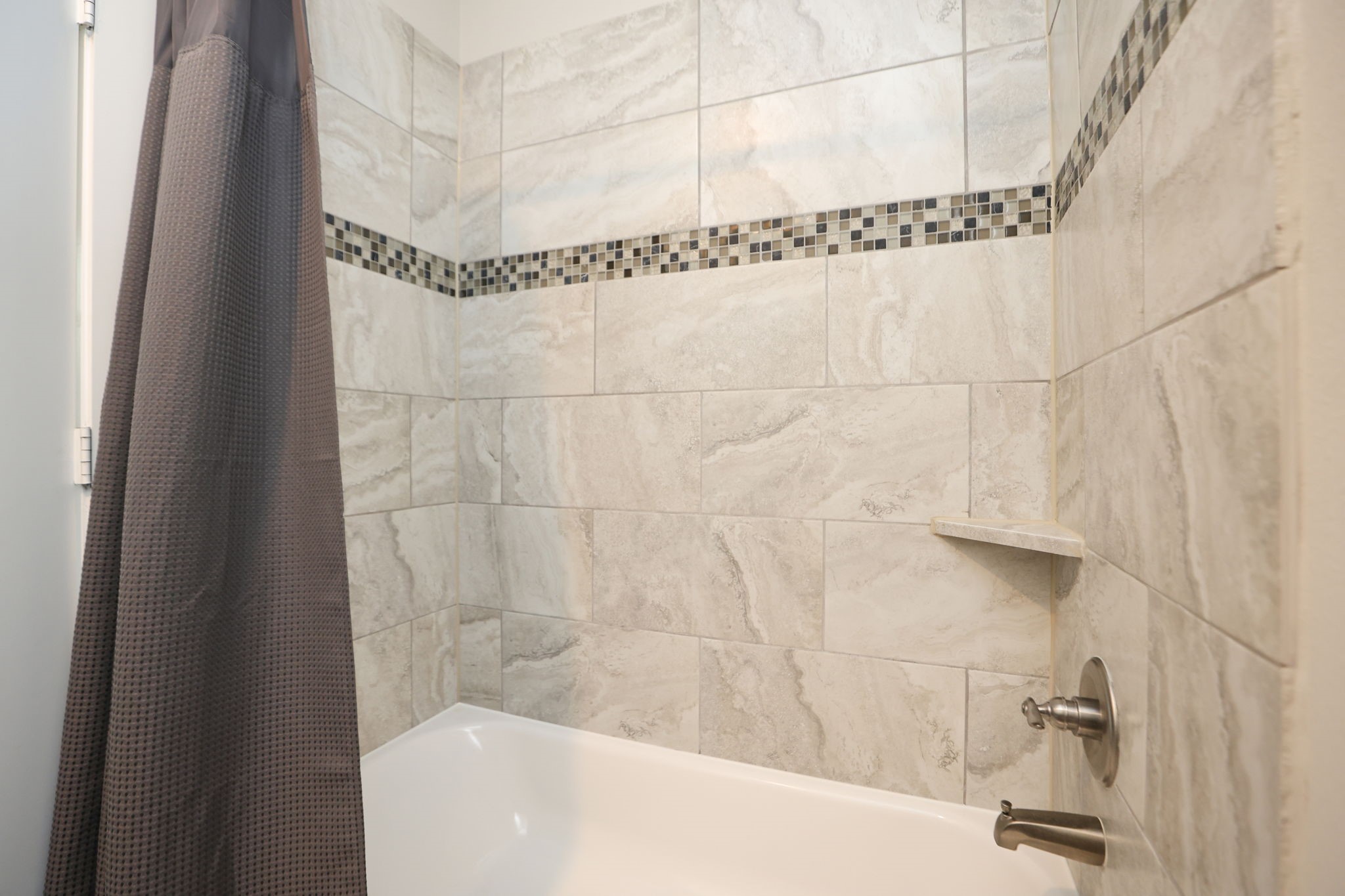Whole home has modern tile work and cool, neutral colors - ready for your personal palette and decor!