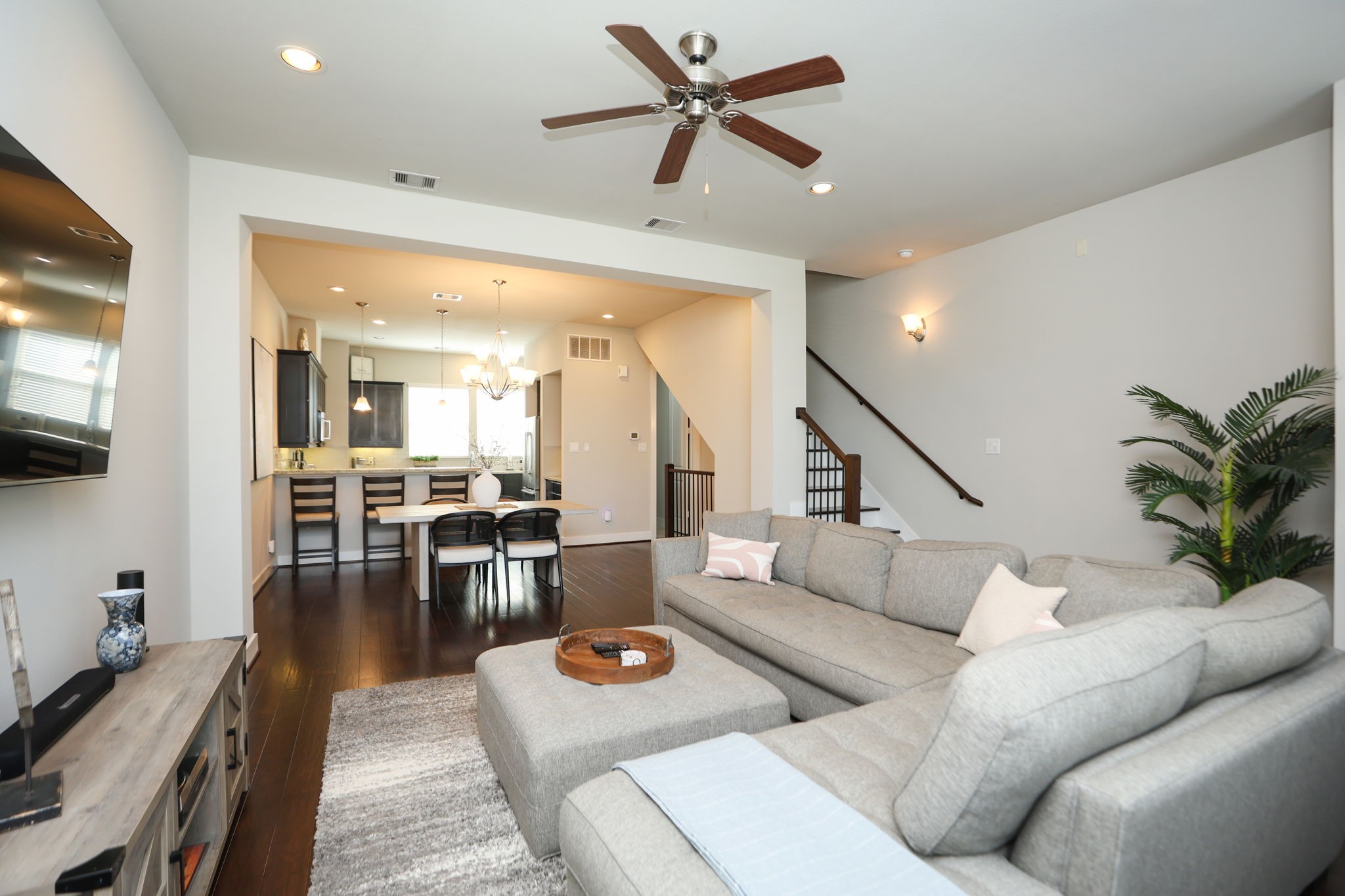 View back across this amazing open living space. Ceiling fans and all hardwood floors make this home comfortable and clean!