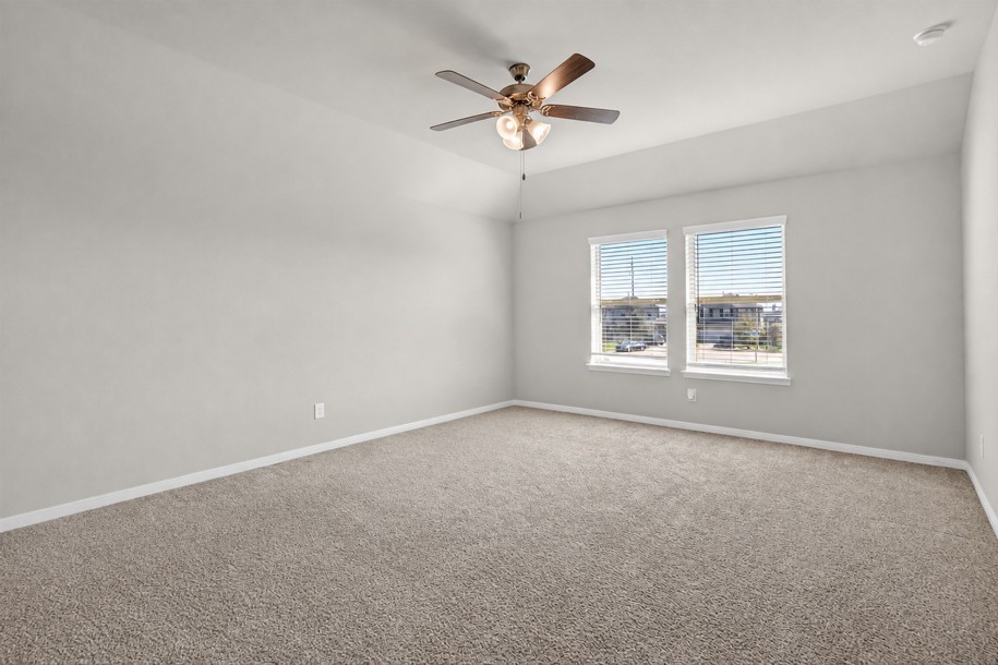 Spacious primary suite with plenty of space to unwind.