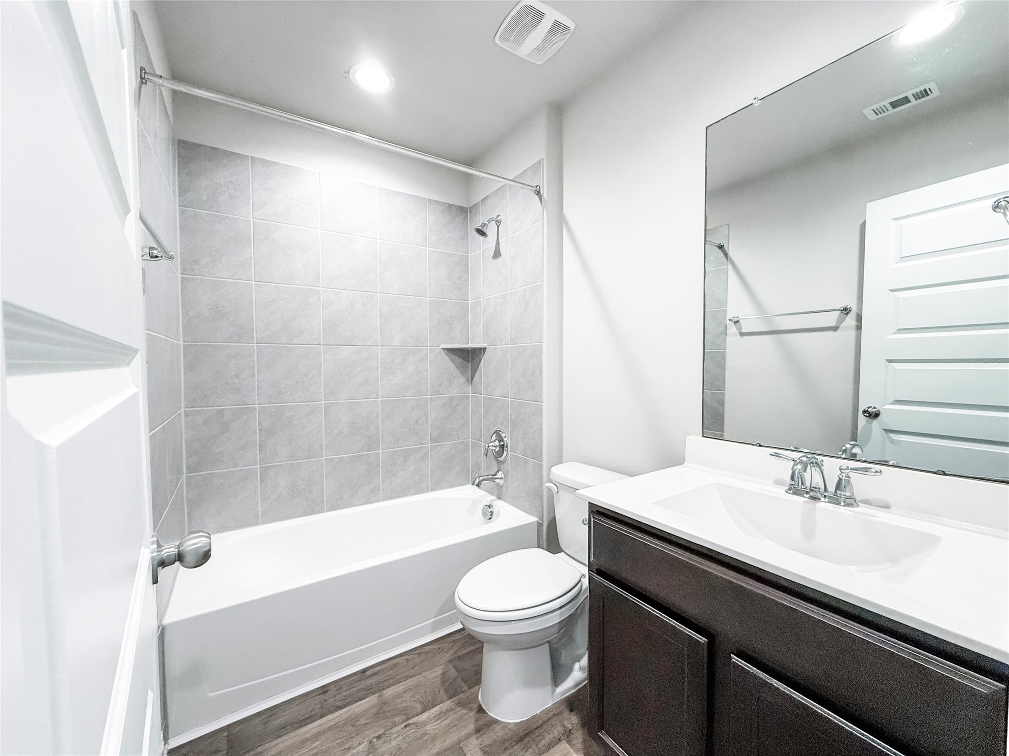 Bright, functional secondary bathroom with a clean finish.