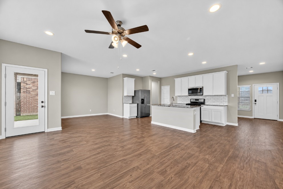 Open-concept living, dining, and kitchen area made for gathering.