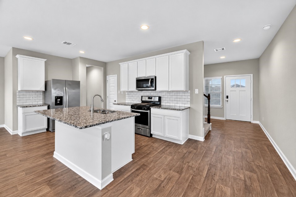 Open kitchen with ample counter and cabinet space.