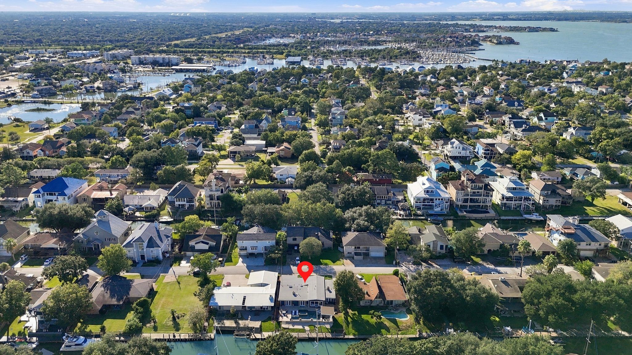 Charming waterfront property nestled in a lush, vibrant neighborhood with easy access to scenic waterways and nearby amenities.